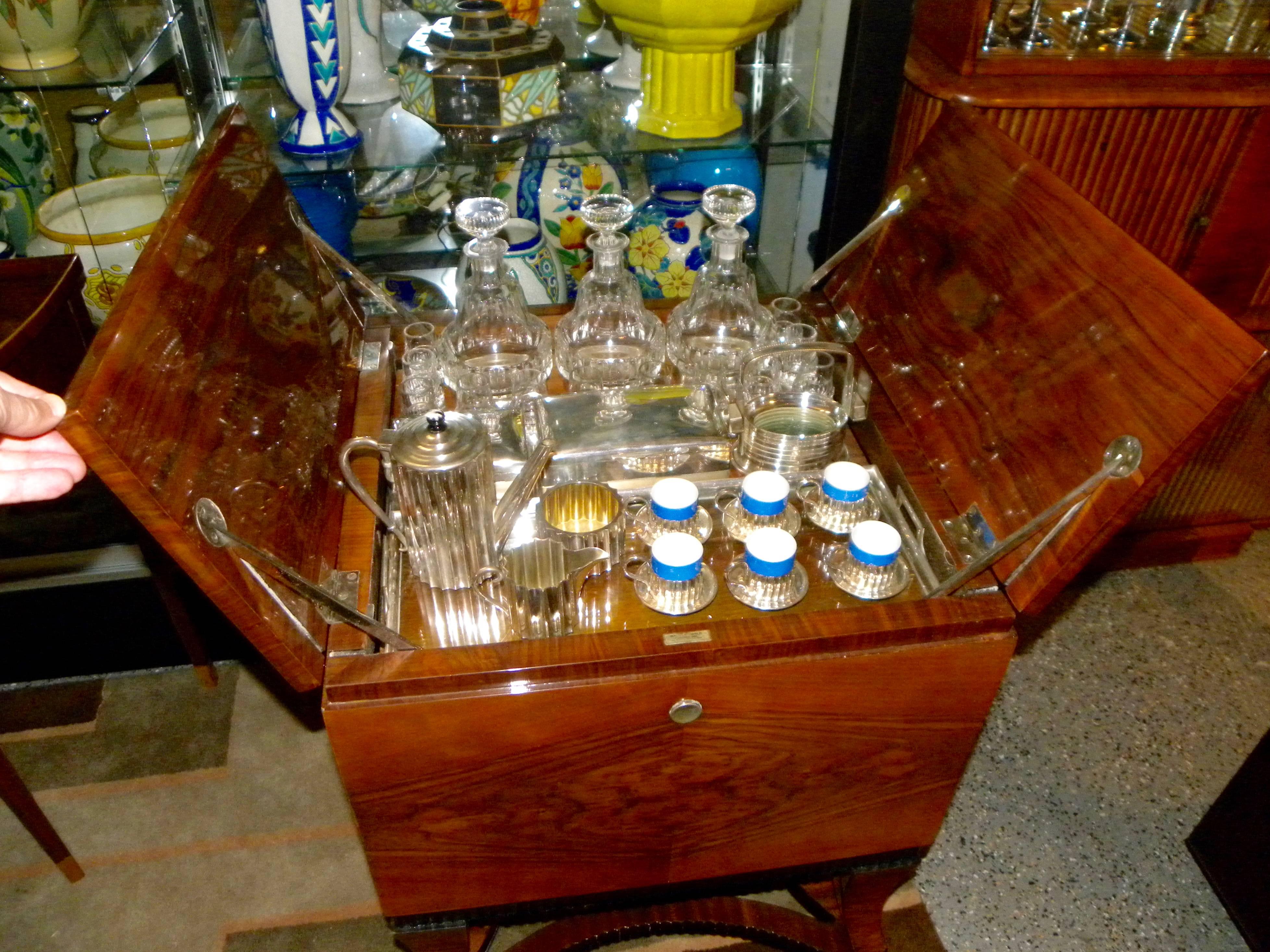 This complete and elegant French style Art Deco pop up bar has absolutely everything tucked inside ready to be offered up with a presentation of sheer sophistication. This original piece from Argentina was sold by Walser Wald, a prominent jeweler