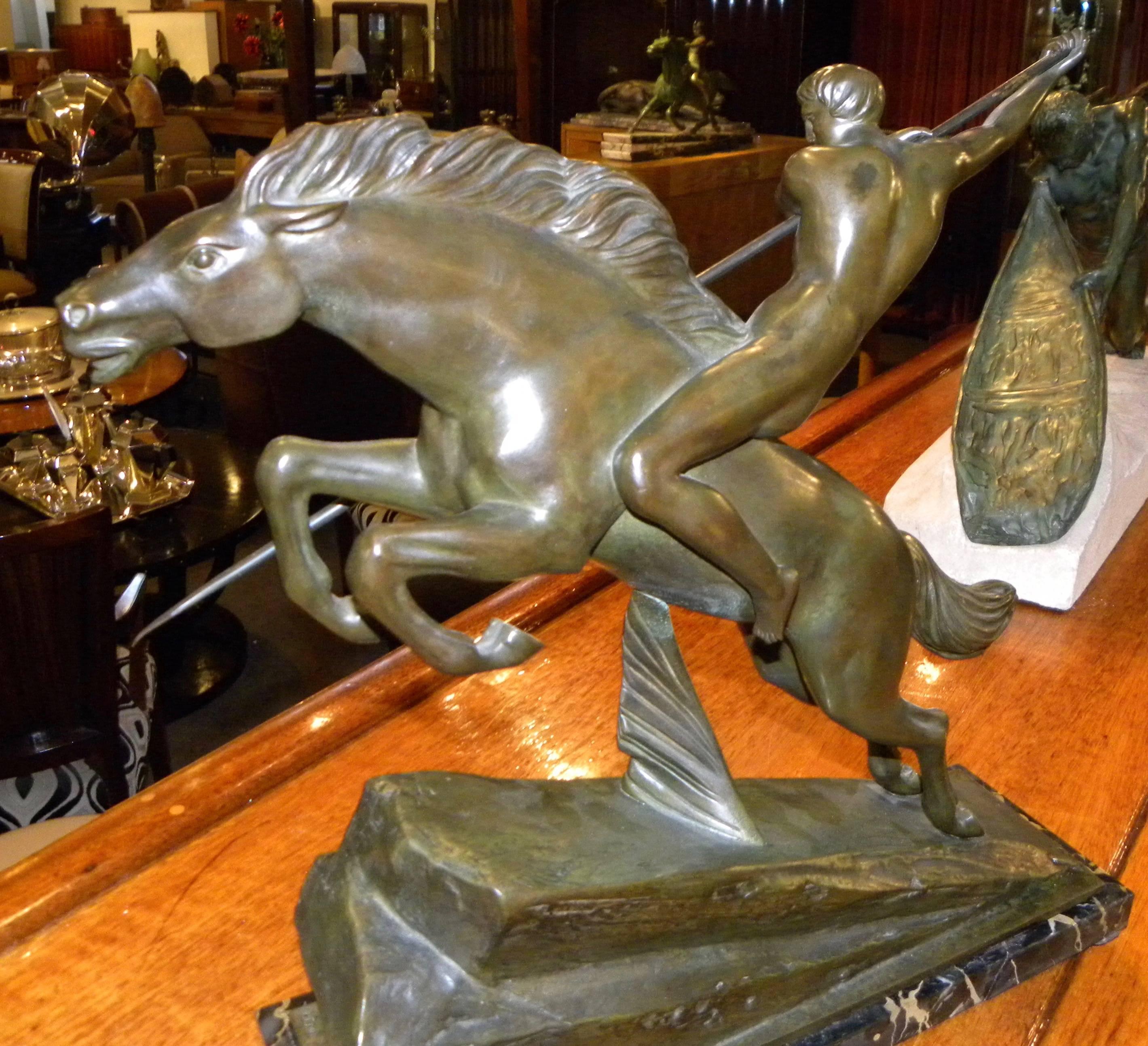 An Art Deco bronze by French sculptor Armand Lemo that captures the essence of speed, power and strength in both the galloping horse and the warrior.

So many things make this statue a Classic: The singular spear being used as a focal point, the