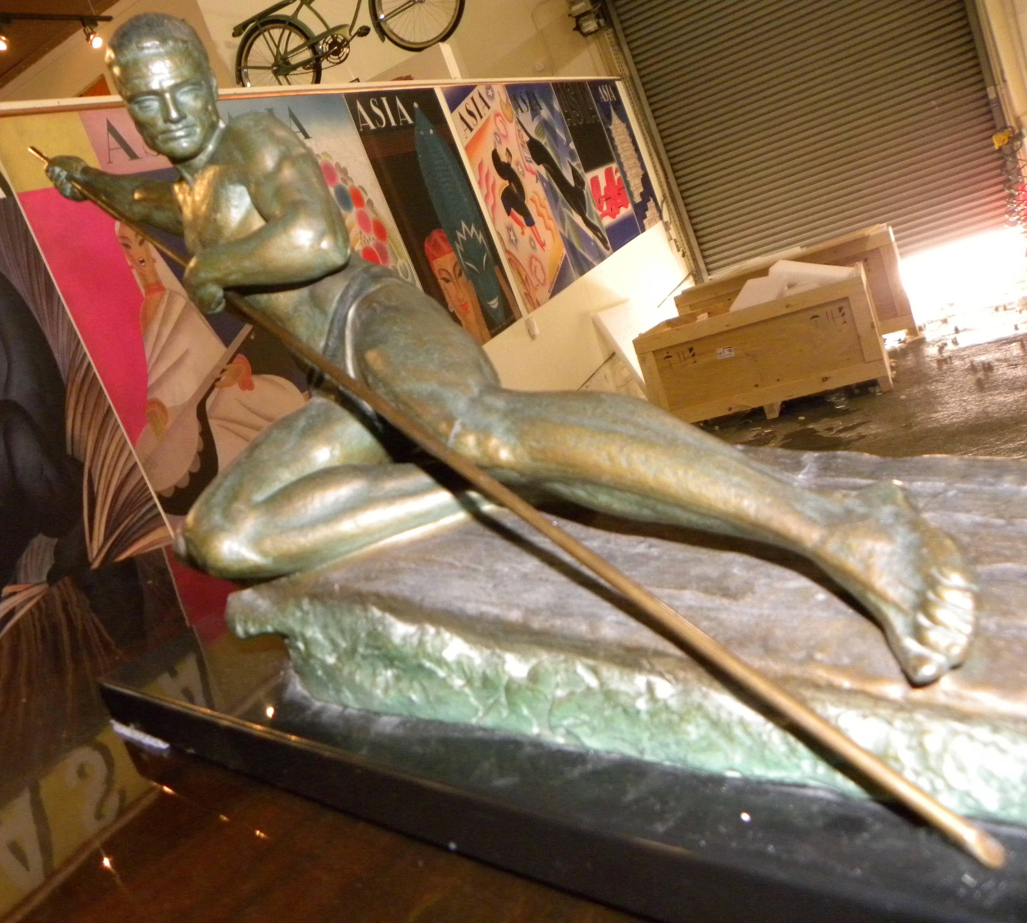 This is a masterful piece of Art Deco sculpture by Ugo Cipriani, an artist well known for his deco themes, French style expressive faces and a sense of movement. This full weight bronze has a beautiful patina. A hint of aqua tone brings out the