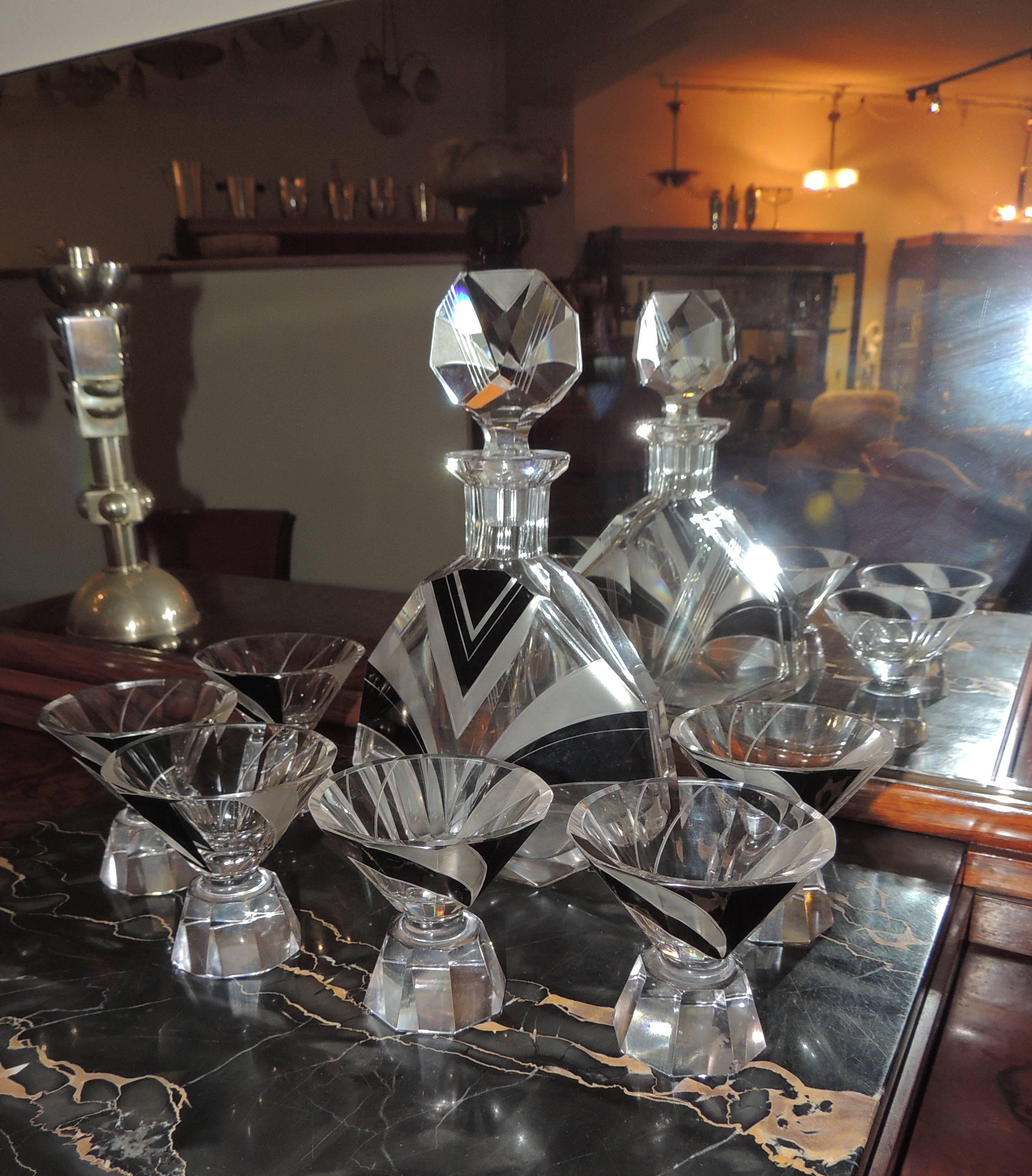 Classic Art Deco Czech glass decanter with matching stopper and six glasses on graceful bases perfectly embodies all the elements of style from the era.

When a client asks “I have to buy a gift for someone who loves Art Deco – what do you