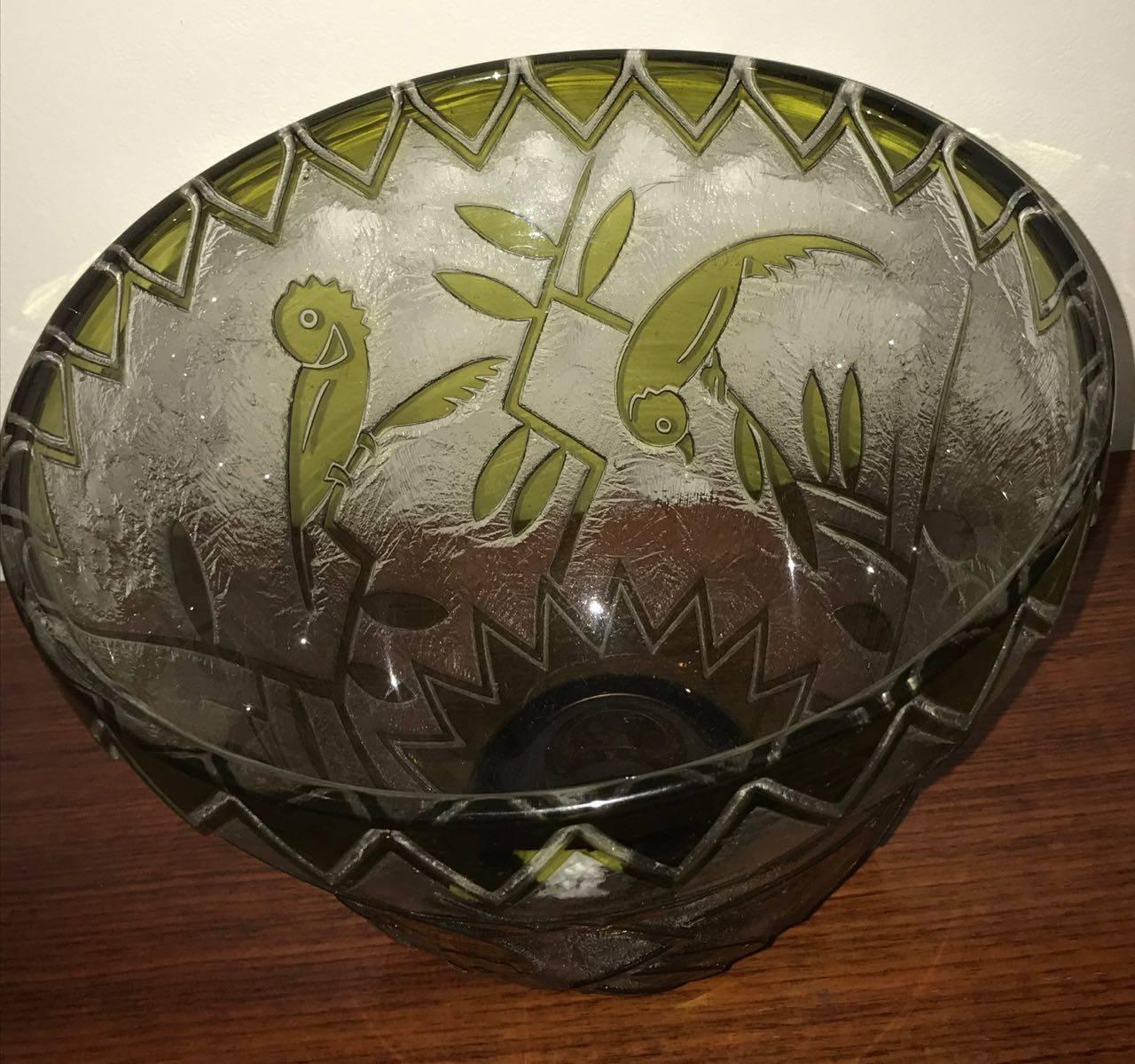 Outstanding acid etched cameo glass with bird/parrot motifs, this is an extremely rare Daum Nancy Art Deco vase. Exceptional details with triangular chevrons at the top and free flowing multiple bird designs and plant designs surround the outside of