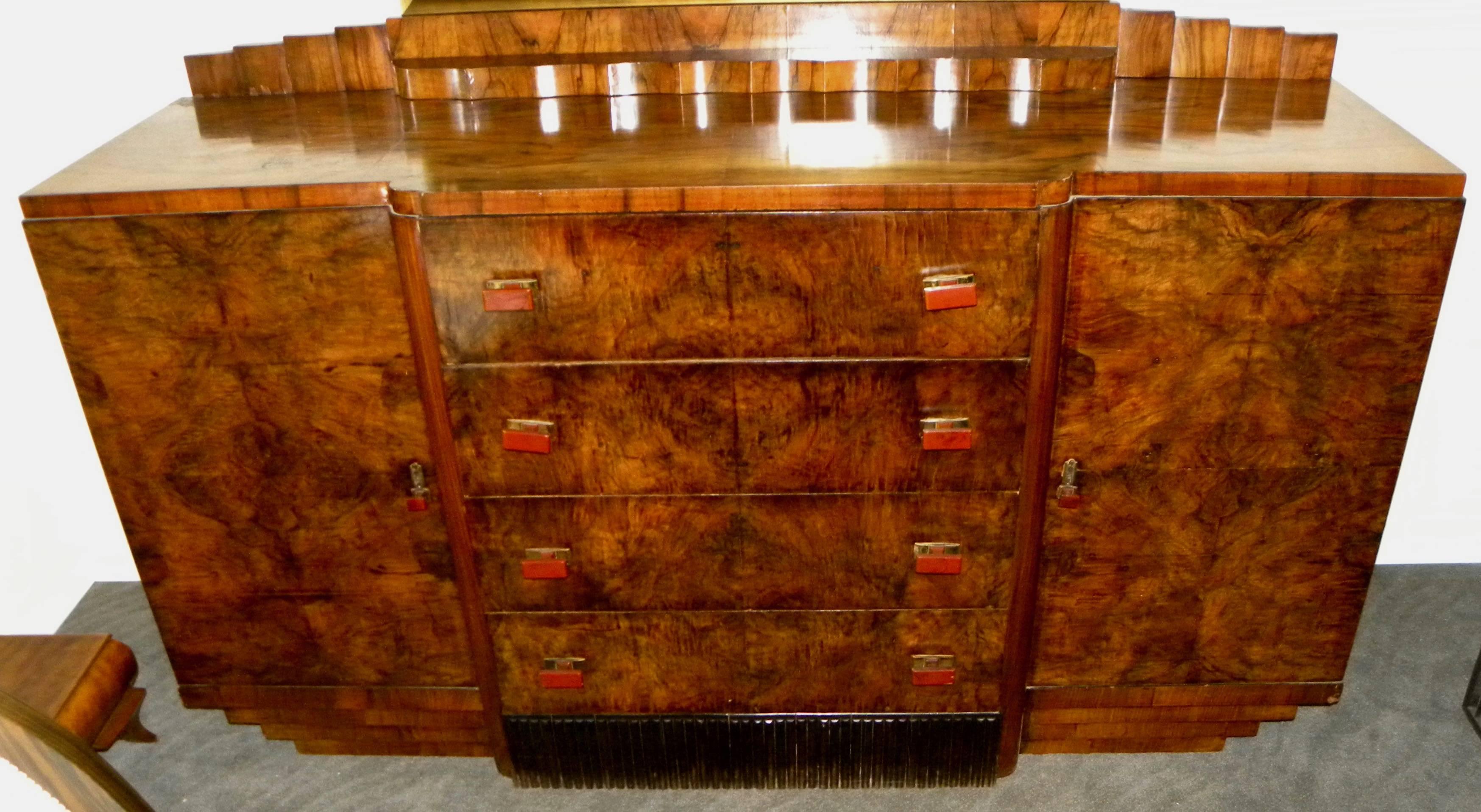 French Art Deco buffet or storage cabinet with some of the most spectacular bookmatched walnut wood veneer I’ve ever seen. This piece offers a nice and very useable size, with large storage opening on each side and four matching drawers with