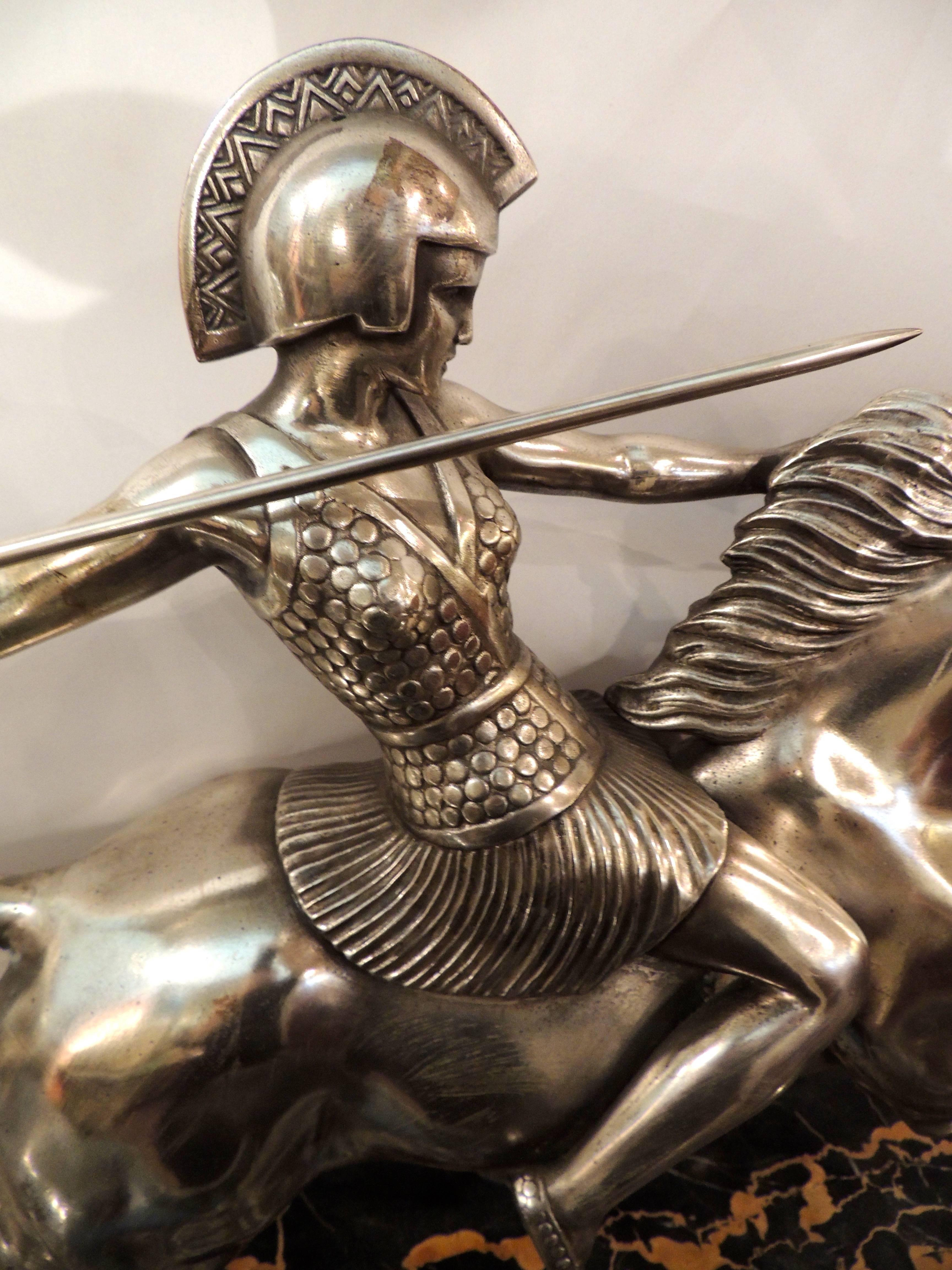 Magnificent Art Deco sculpture of Athena, the Goddess of War and Wisdom portrayed as a warrior on horseback. The sculpture is plated in silver on a richly veined and layered marble base. Melo is a sculptor known for his equestian themes in both