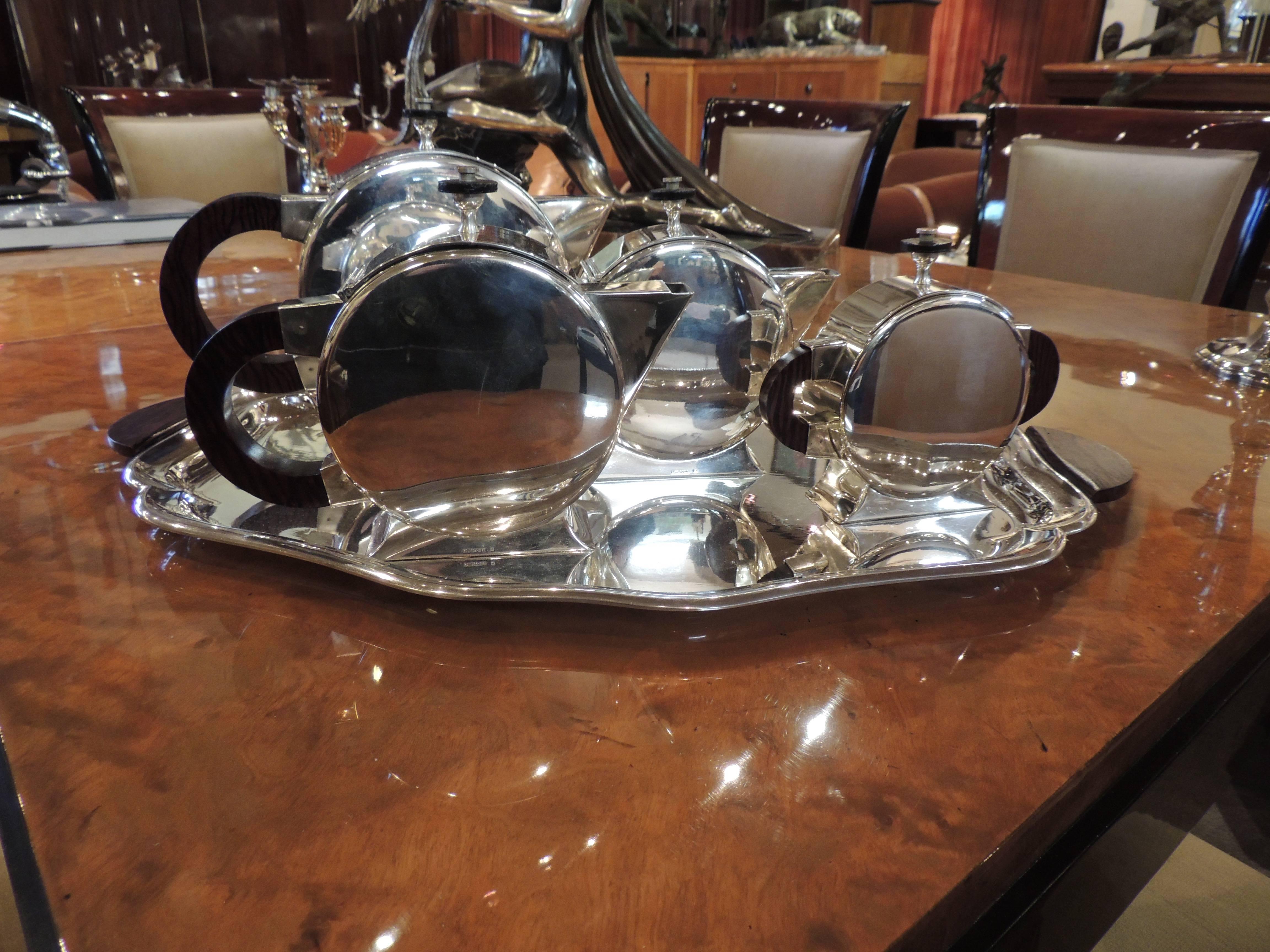 In 1930 for Christofle and was used in the ultimate setting of Deco Luxury- the great French ocean liner Normandie.

The unusual round, and voluptuous shape of the teapot, coffee pot and creamer are streamlined style at its best! Heavily plated in