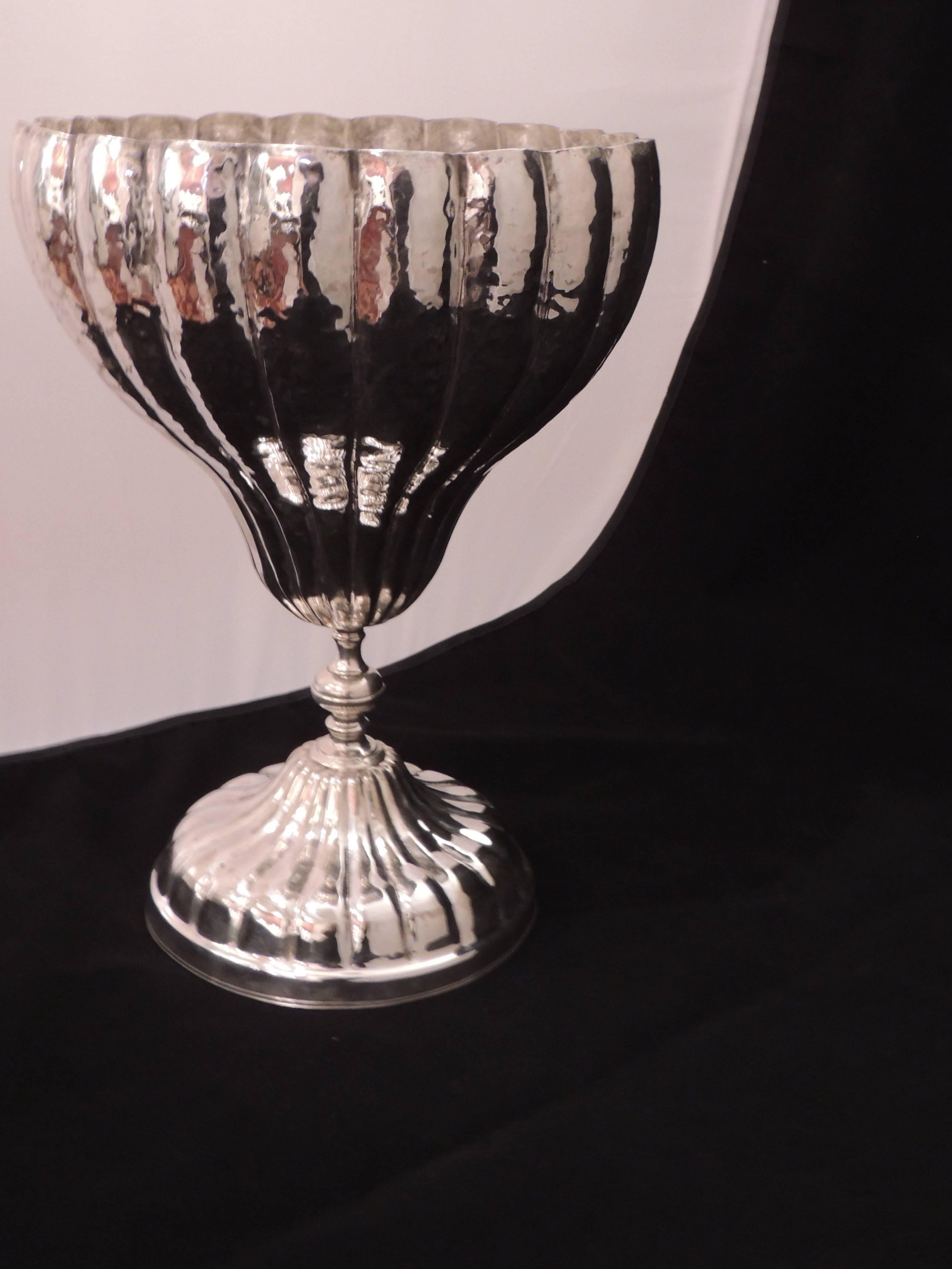This monumental French silver chalice can be a decorative piece for a tabletop, filled with fruit and flowers or simply as a piece to be admired. This one, in delicately hand crafted silver is stamped on the bottom with the initials” A G ” and ”