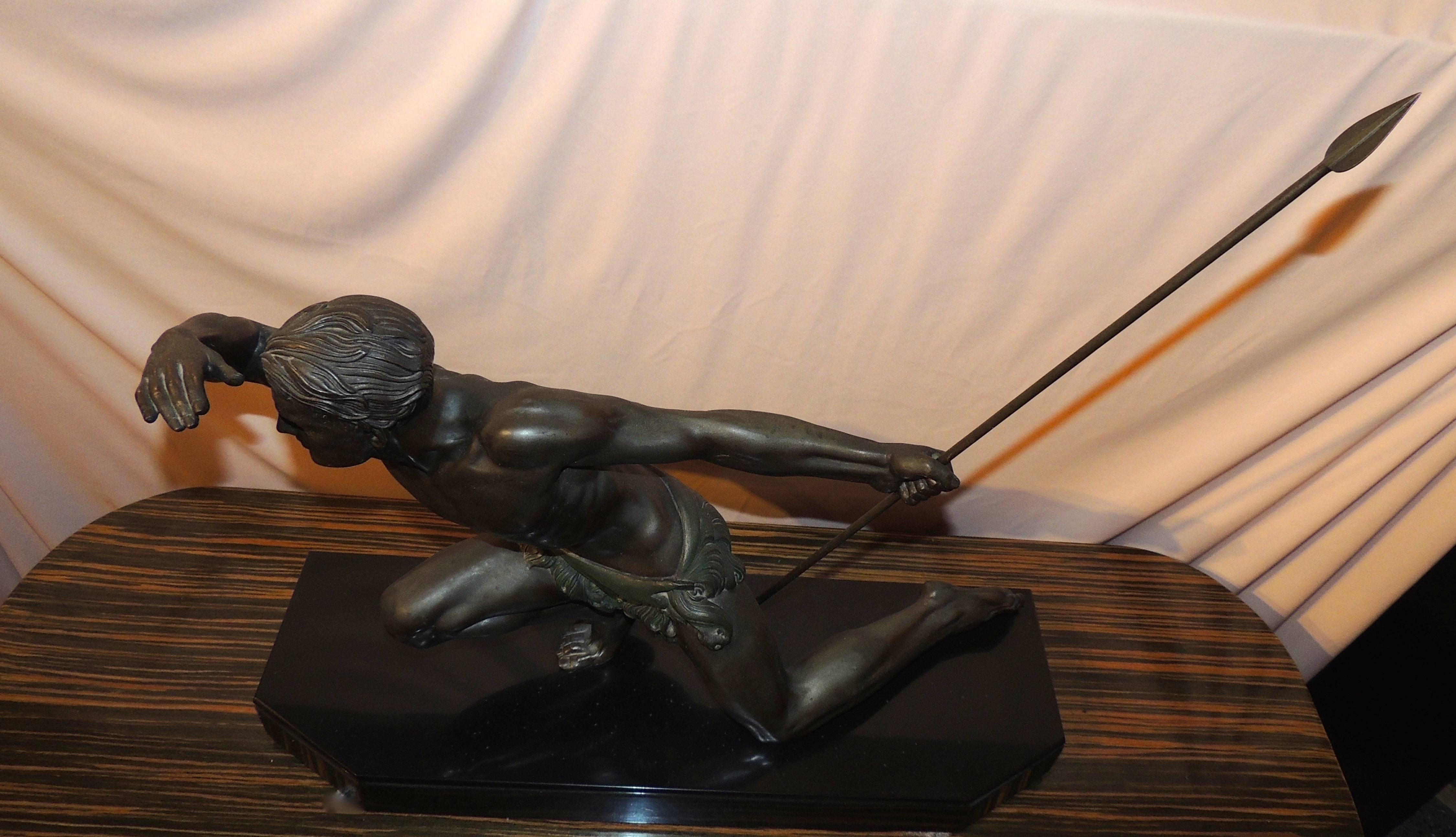 Captures the essence of the athleticism and beauty of the male form. Cast in metal with nice patina a touch of cold painted detail, it sits atop a black marble base. The details are exceptional. Note the contrast of the wavy hair, the folds of the