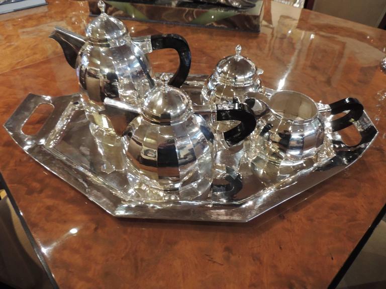 An elegant Art Deco tea and coffee set that is dome topped and multifaceted. Nothing can make you feel quite so pampered as having tea brought in on a silver tray . What? You have no Butler? You have no maid? Ah but you can still have it “made” with