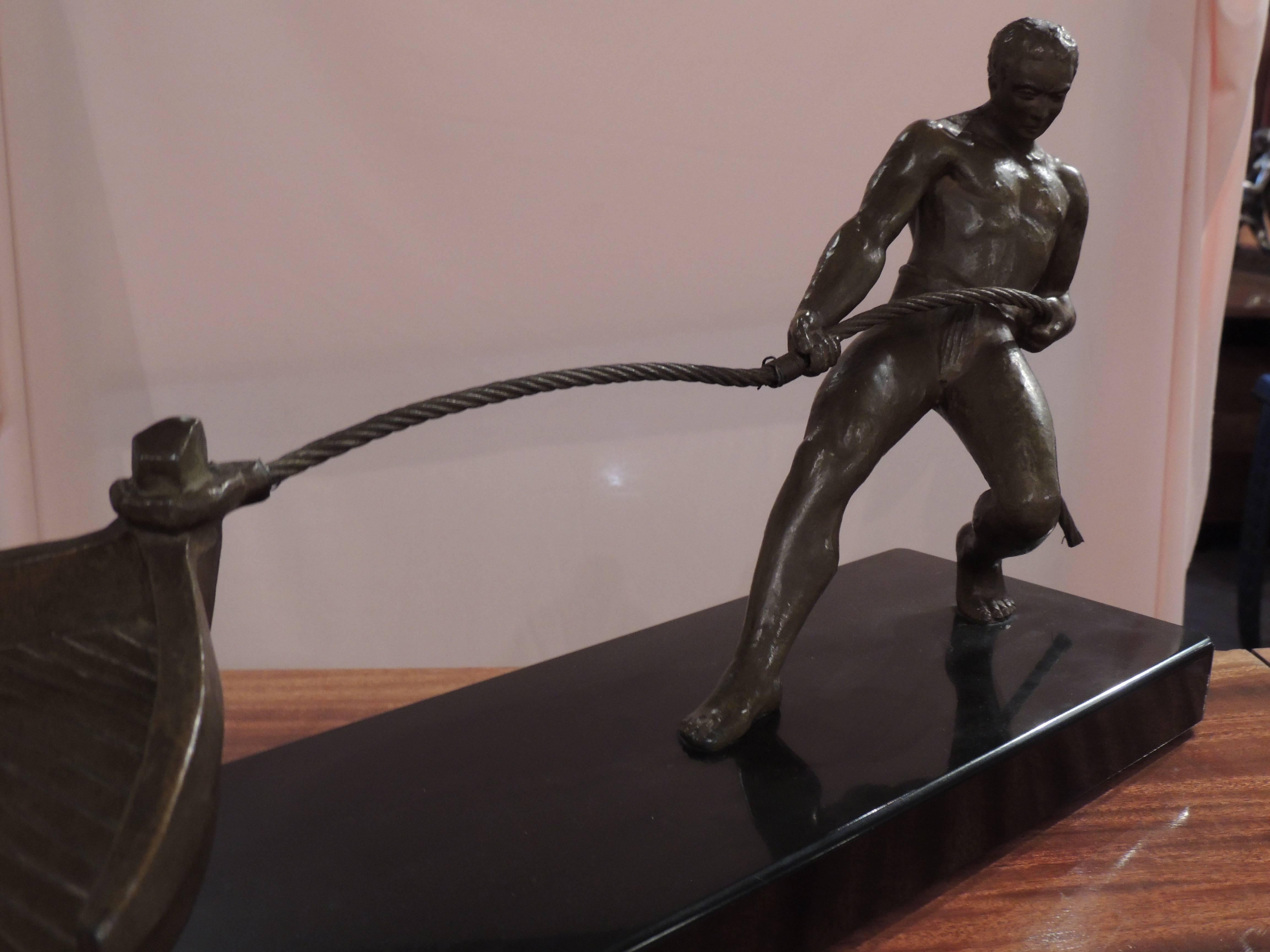 French Art Deco Bronze Statue of Man Pulling Boat Sculpture For Sale