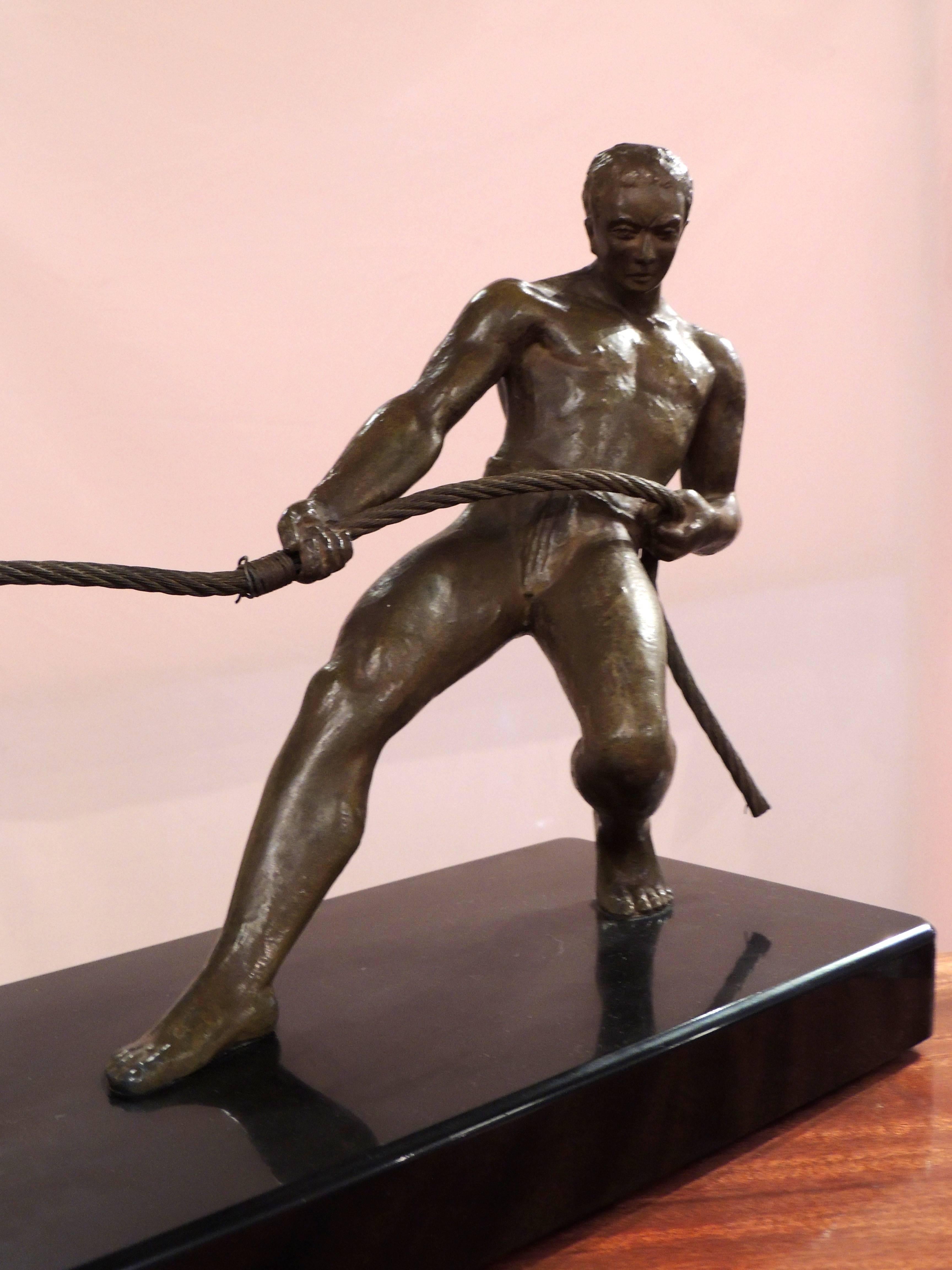 Mid-20th Century Art Deco Bronze Statue of Man Pulling Boat Sculpture For Sale