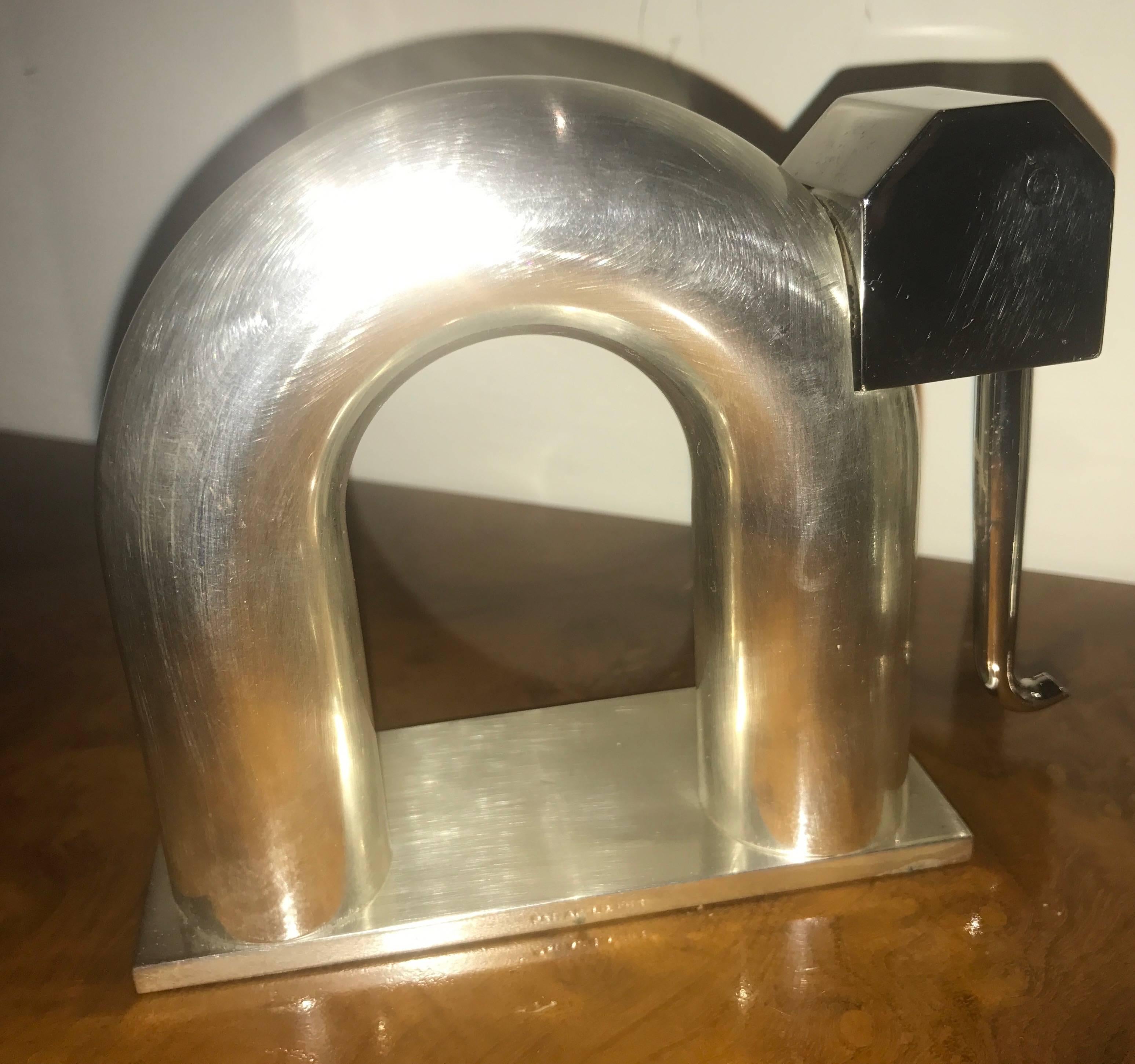Chase nickel-plated brass elephant bookends. Unusual finish with satin nickel body and polished nickel head and trunk. Important design by famous Industrial Design Pioneer Walter Von Nessen who worked for Chase and designed many of the company’s
