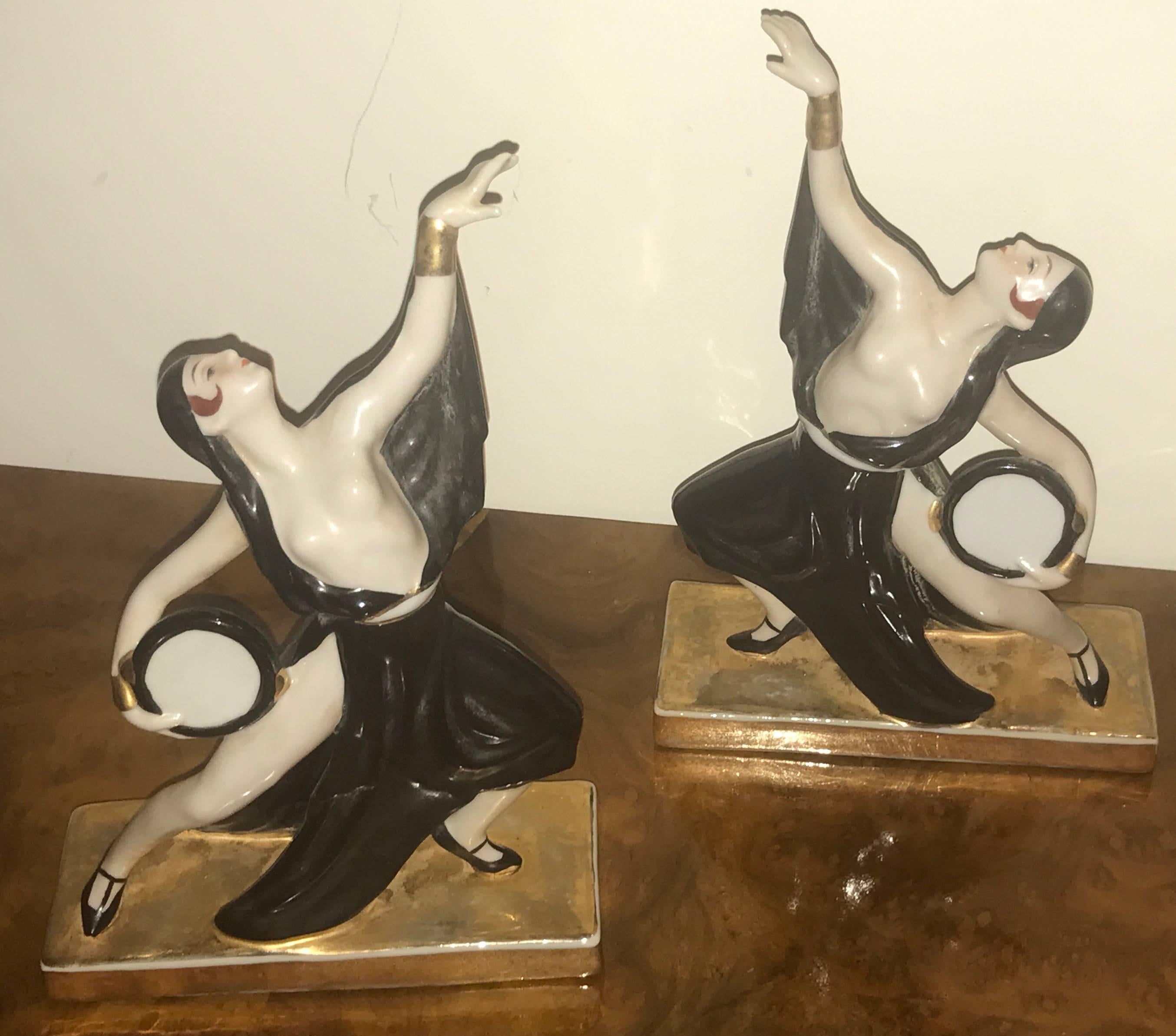 Bonbonniere candy jars. ROBJ was a master of decorative art in the early 20th century, and much of the wares that bore the ROBJ name were commissioned from Limoges. These are a pair of Art Deco porcelain “Tambourine Dancers” in black, cream, henna