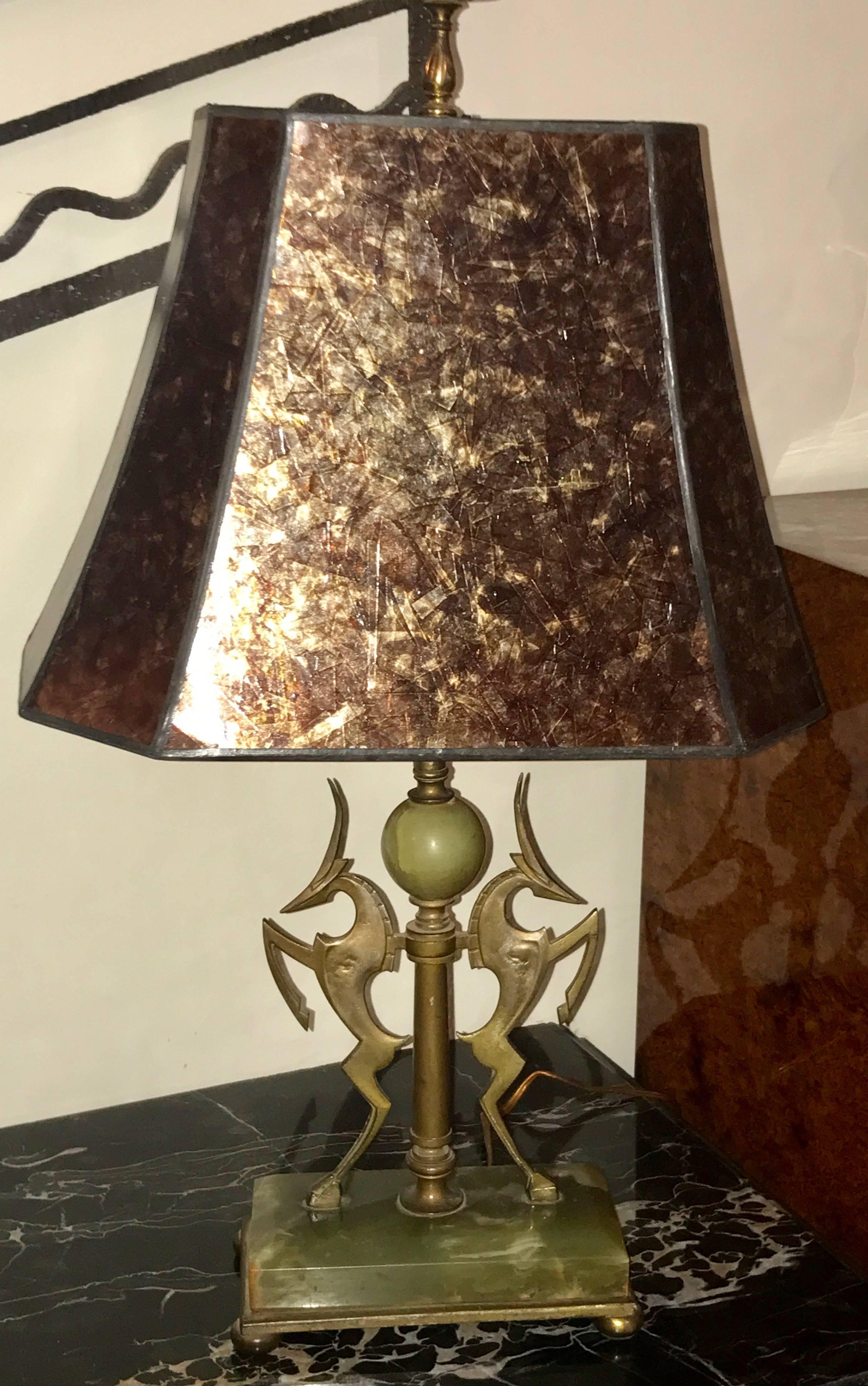 1930 Art Deco table lamp with sculptural details of cubist silhouette style gazelles surrounded by nice bronze, brass and green Onyx. Exceptional Art Deco table lamp attributed to or in the style of Wilhelm Hund Diederich. Double socket pull chain