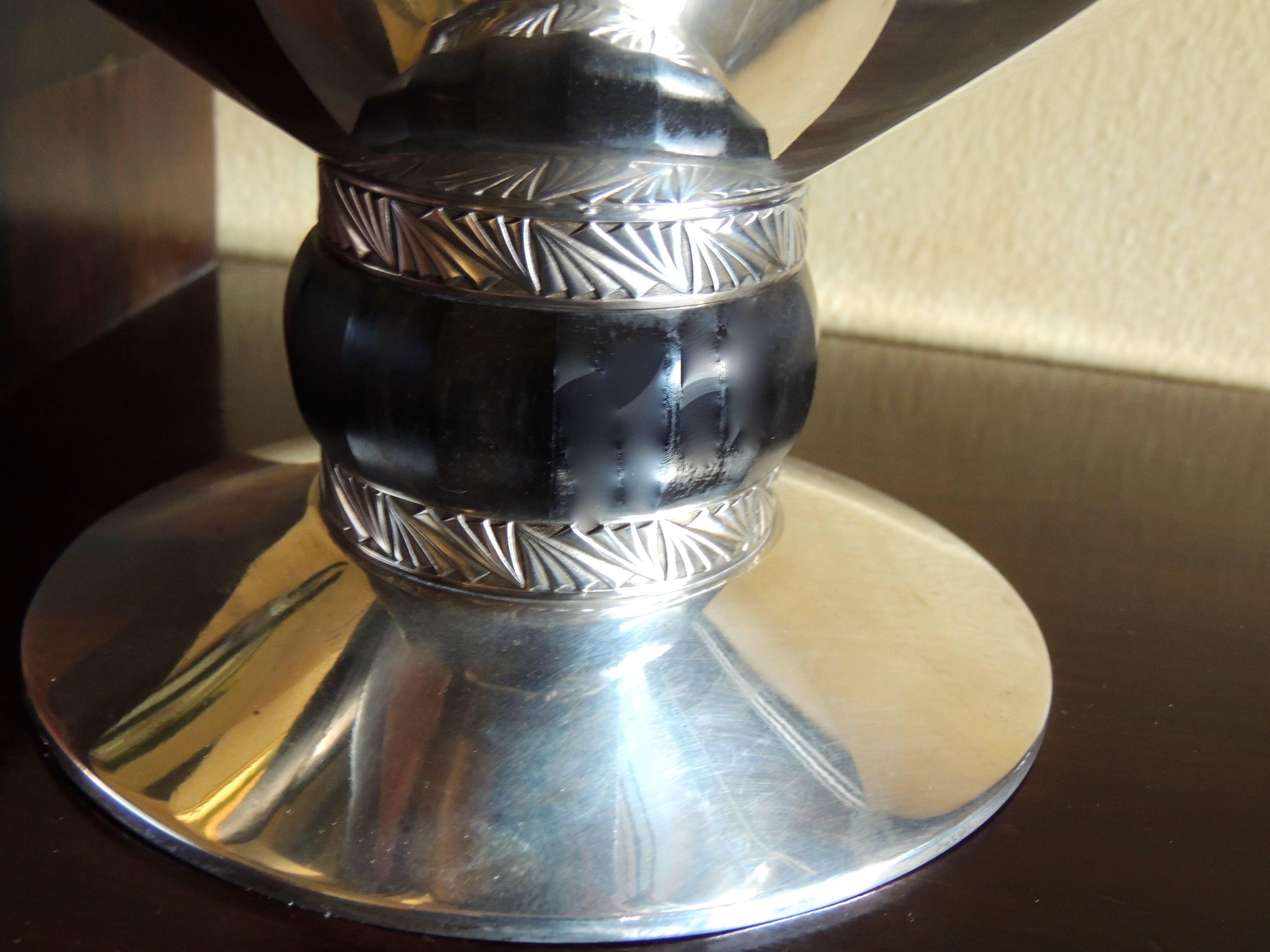 A silver Art Deco compote with ebony base and Art Deco embellished stand makes a perfect centrepiece to be used in many ways. We love the fluted wood Stand with rings of geometric patterned silver that encircle it.

A “compote” is really a