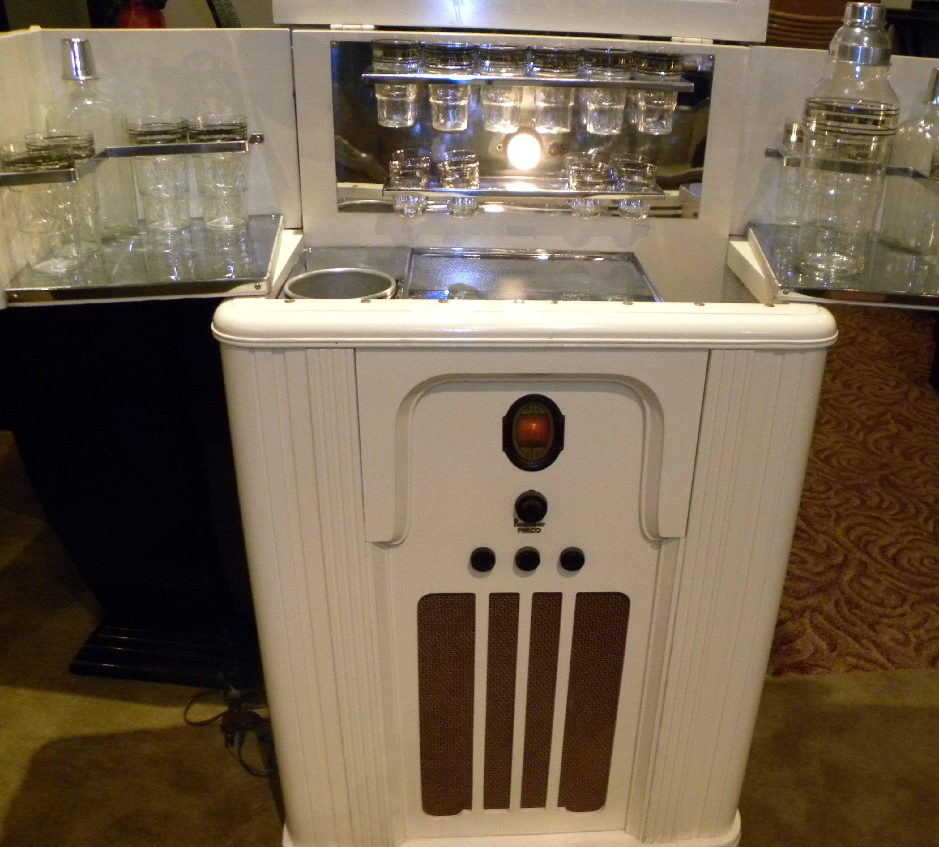 This spectacular Art Deco Philco radio bar is one of the most highly sought after pieces by radio and bar enthusiasts alike. Created originally during the Prohibition era, a time of fascination with hidden and secret liquor bars, it reached a high