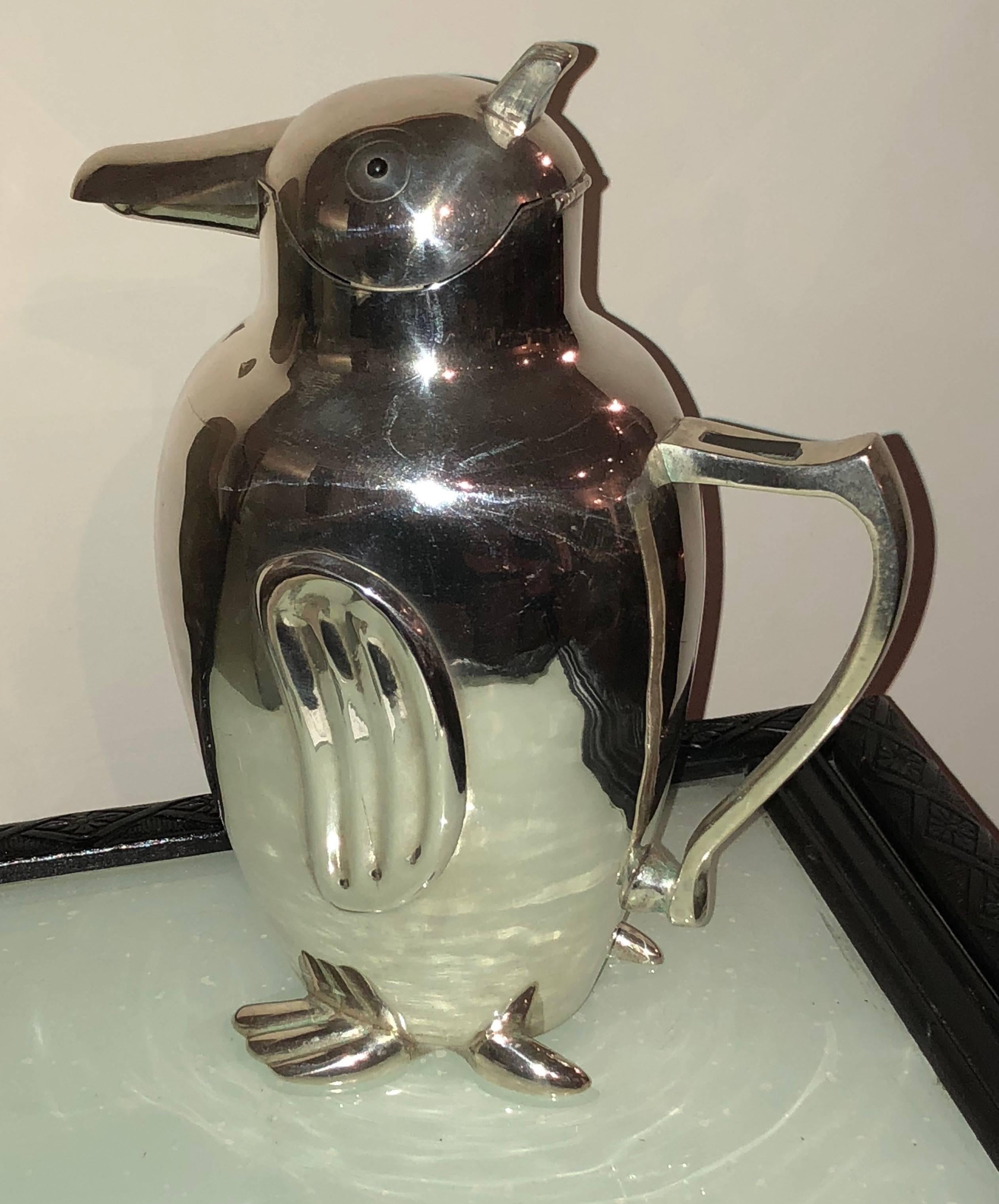 Vintage penguin shape cocktail shaker or pitcher. A very rare piece based originally on an Italian design. This one here reflects just a few of the authentic vintage penguin shapes sold today in the collectibles market. 

This 1930s era model in