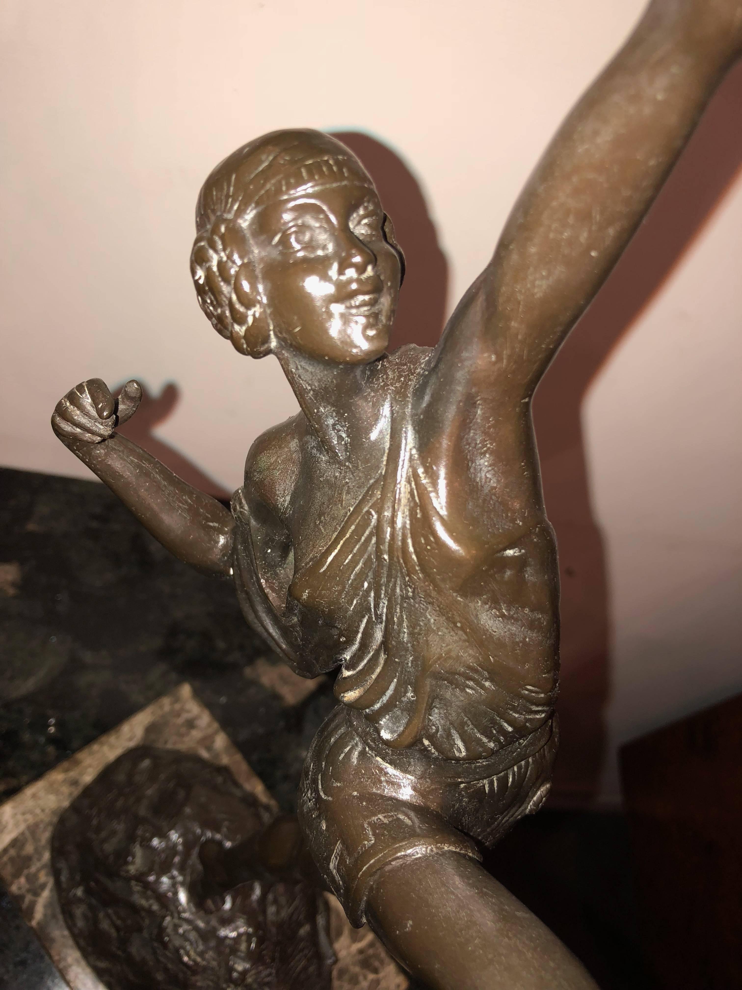 French sculptor Pierre Le Faguays, circa 1925, this Art Deco bronze sculpture was cast by The Susse Freres foundry in Paris France. The statue highlights exquisite detailing on a naturalistic base. The sculpture is titled, “Tireuse A L’arc,” loosely