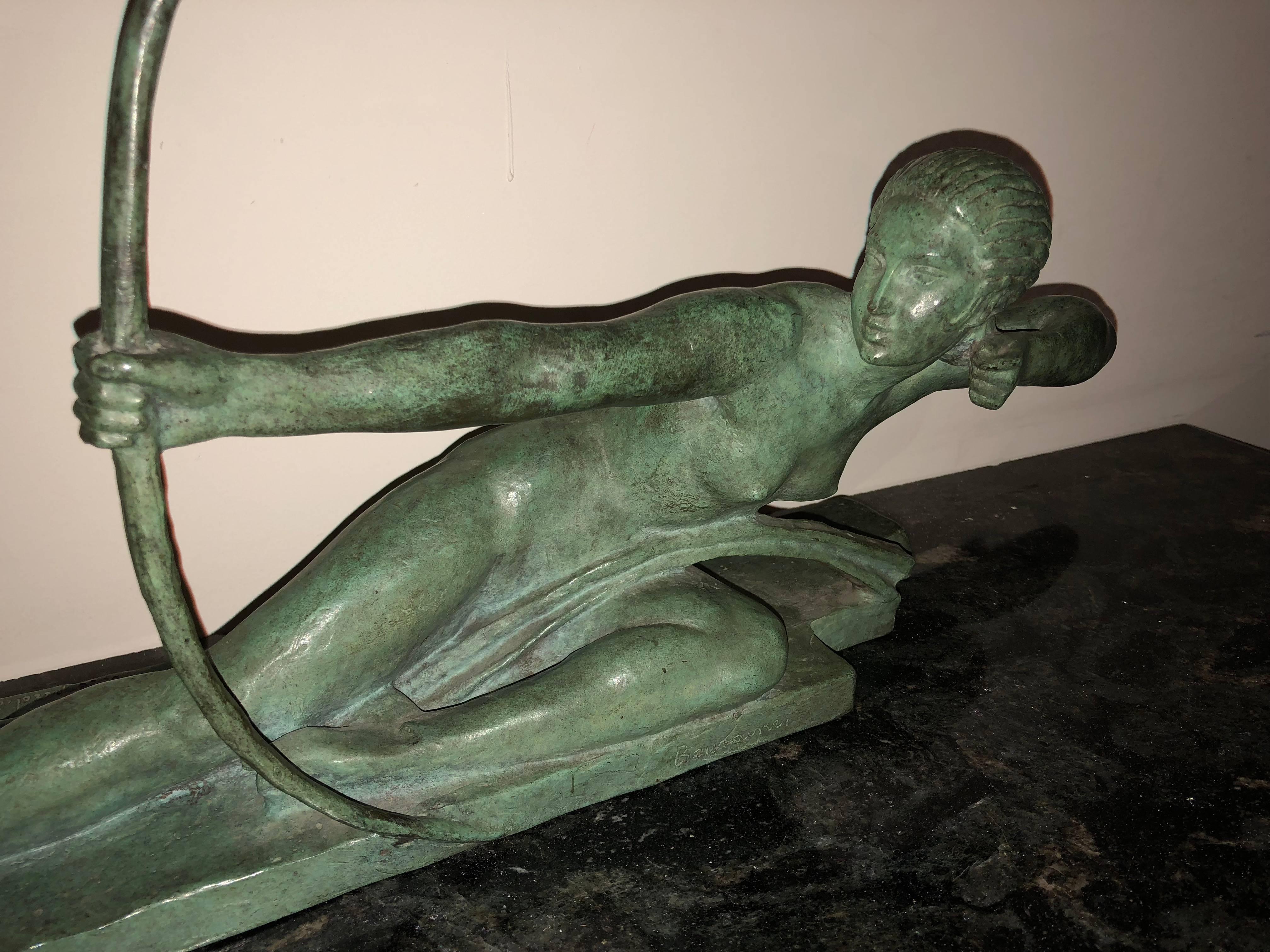 This important sculpture by Marcel Andre Bouraine of “Penthesilea, queen of the amazons”, is cast bronze in the rarest green/verte color patina. Depicted is a naked woman archer Art Deco style and signed Bouraine on the front with seal of the Susse