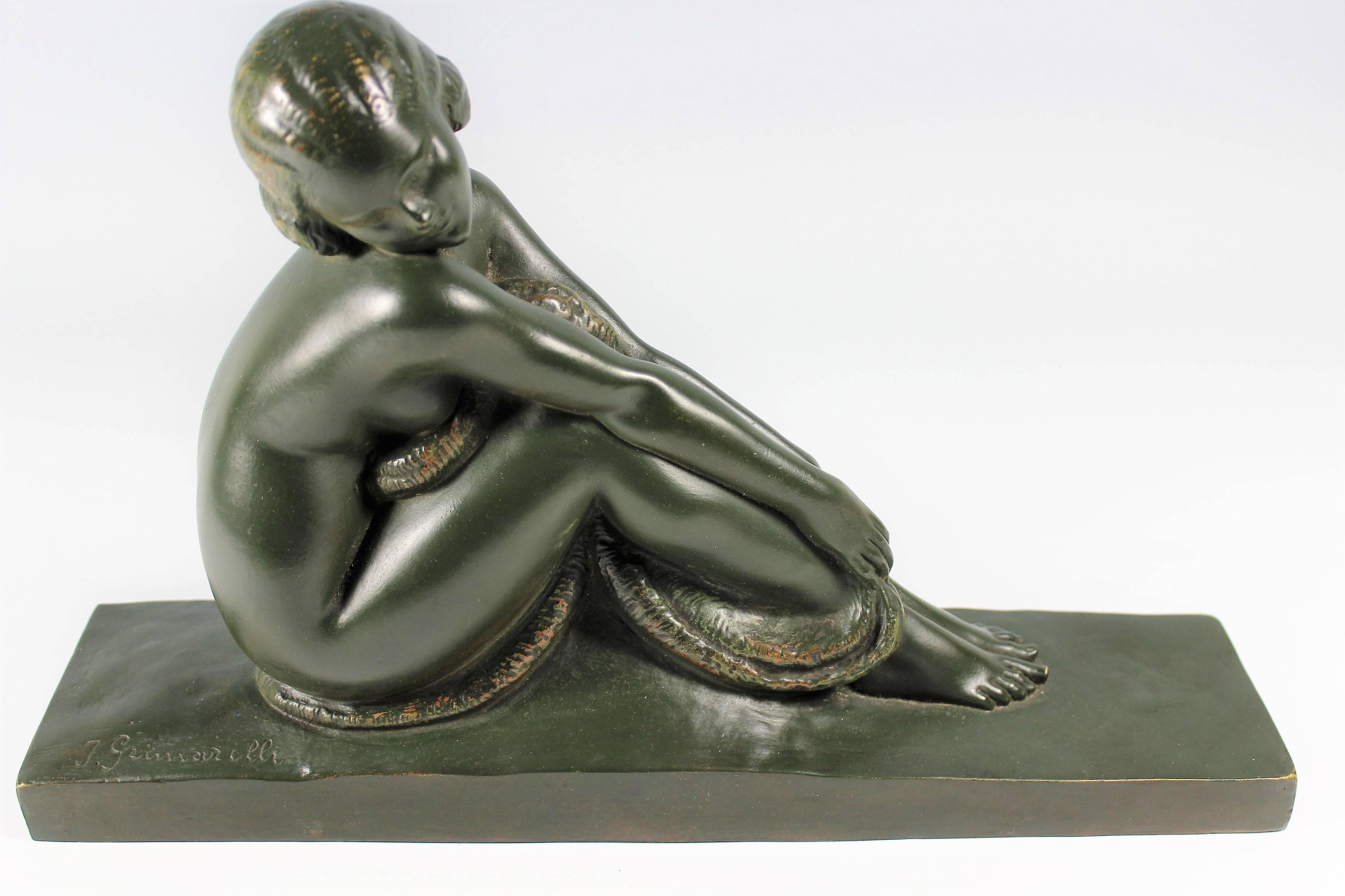 An original patinated bronze nude by Amedeo Gennarelli, circa 1925. This demure young nude model, depicted seated with knees raised and her head resting on her shoulder. A deep green patina signed in the cast ‘A.Genneralli’.

Amedeo Gennarelli