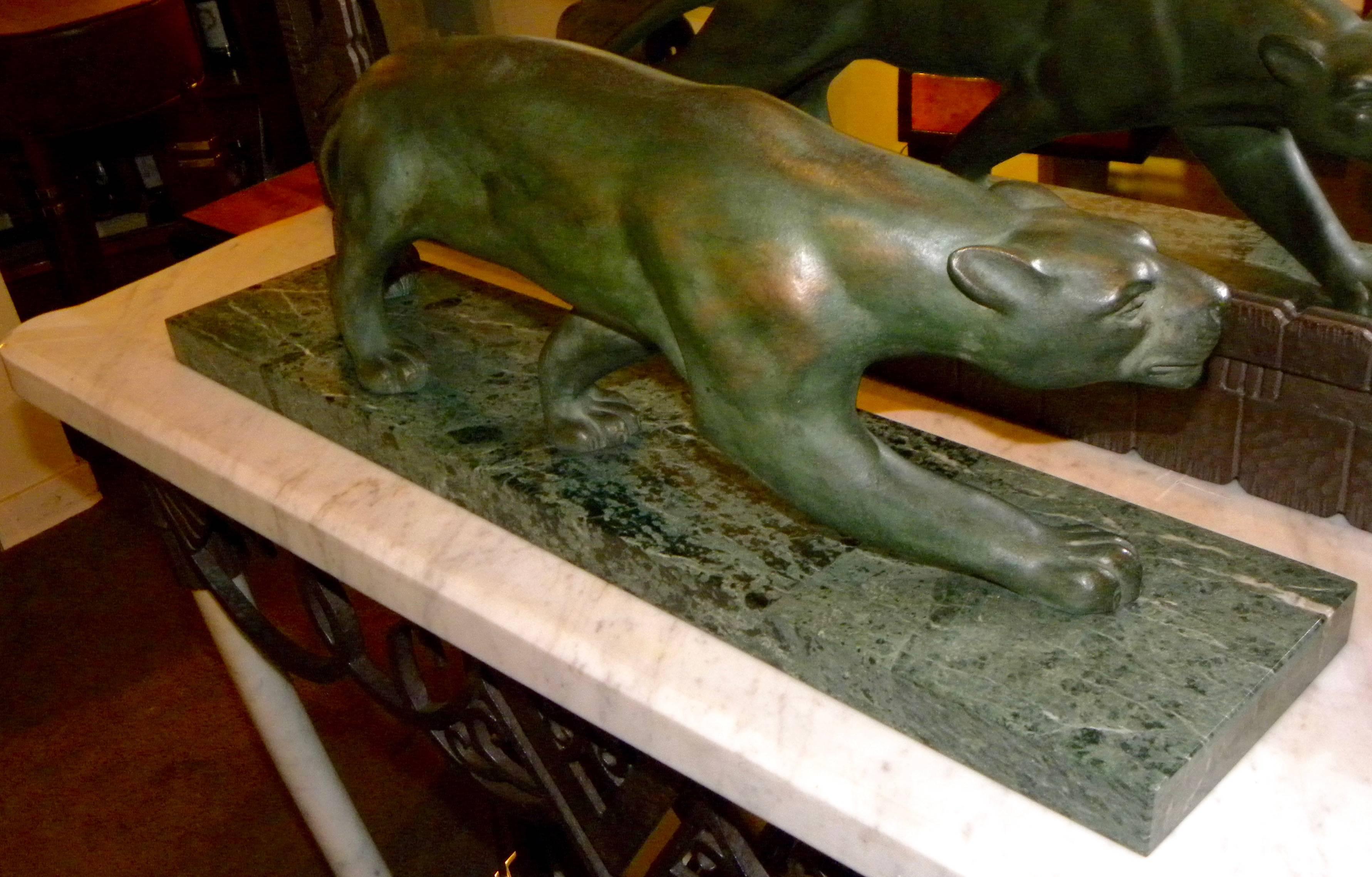 This Art Deco bronze crouching panther is ready to lunge forth in all it’s glory. The jungle cats were an important motif in the deco era as the sylphlike nude female sculpture and in perfect contrast, as these masculine symbols are rendered with