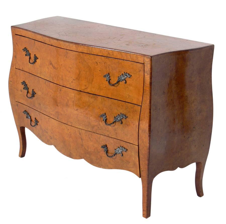Burl walnut commode, Italy, circa 1950s. It retains it's wonderful original patina and wear. Very sculptural form with nice attention to detail, including bronze pulls.