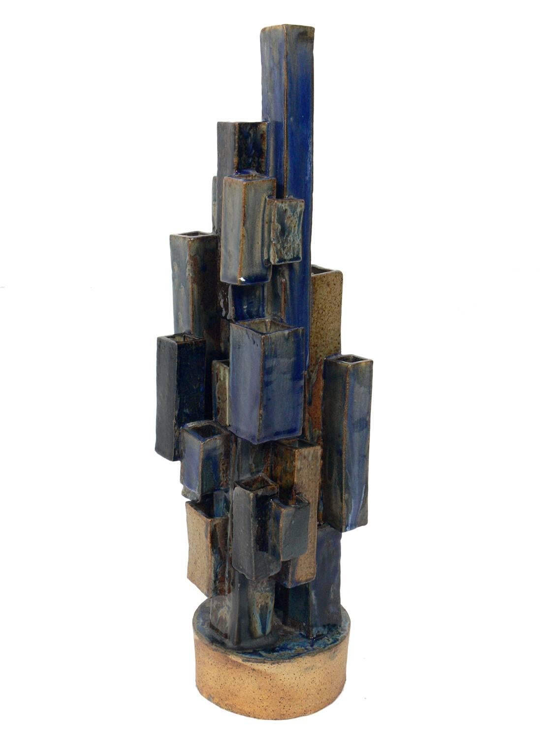 Large-scale skyscraper form pottery vase, artist unknown, believed to be American, circa 1960s. It stands a monumental 24.25