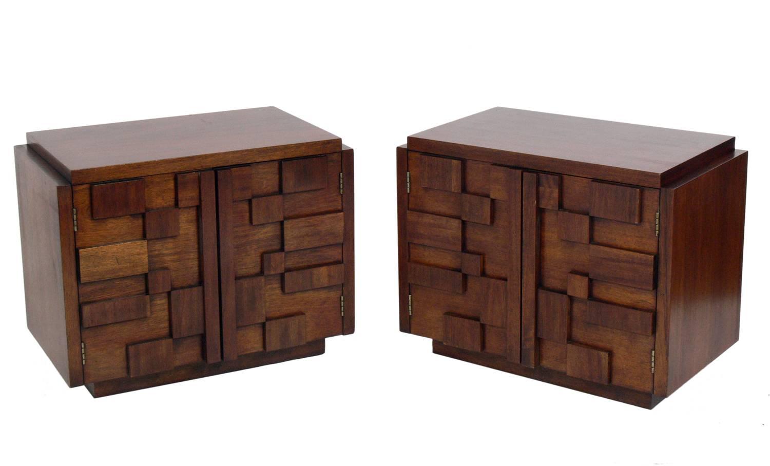 Pair of sculptural Brutalist walnut nightstands or end tables, in the manner of Paul Evans, Louise Nevelson, et al, by Lane, circa 1960s. They are a versatile size and can be used as nightstands, end or side tables. They retain their original finish.