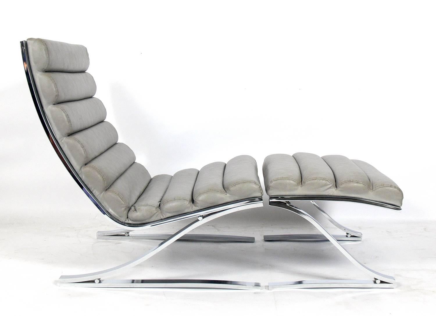 Mid-Century cantilevered chrome lounge chair and ottoman, designed by the design institute of America (DIA), American, circa 1960s. This chair is currently being reupholstered and can be completed in your fabric. The price noted below includes