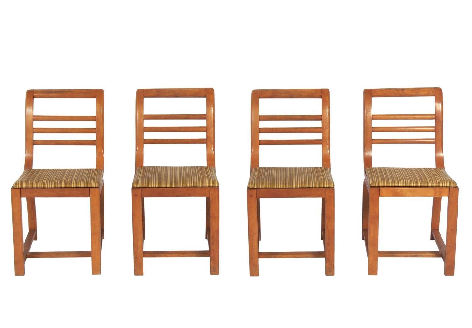 Set of four curvaceous Art Deco dining chairs by Gilbert Rohde for Heywood Wakefield, American, circa 1930s. They are currently being refinished and reupholstered and can be completed in your choice of finish color and reupholstered in your fabric.