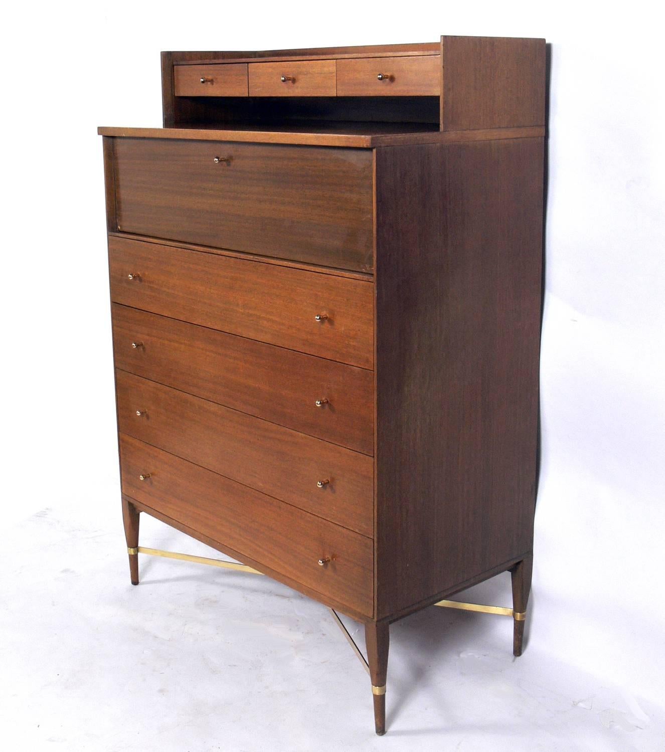 Tall chest of drawers, designed by Paul McCobb for Calvin, American, circa 1950s. Rare to find the integrated jewelry box at the top. This piece is currently being refinished and can be completed in your choice of color. The price noted below