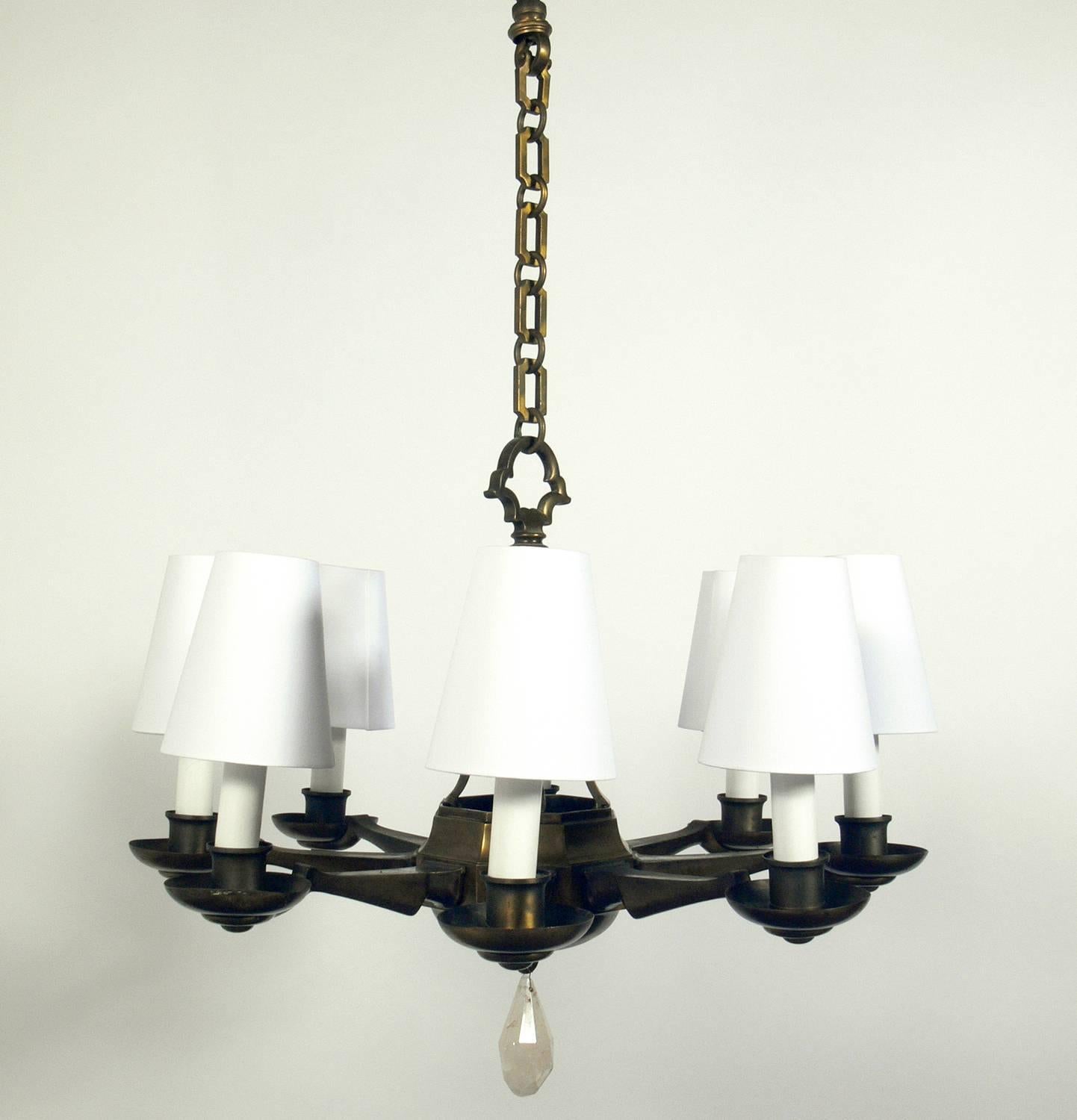 Elegant brass and rock crystal chandelier, American, circa 1920s. It has been rewired and is ready to use. The shades and candle sleeves are all new and included in the price noted below.