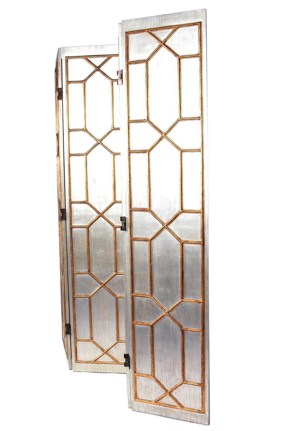 Glamorous silver and gold gilt folding screen or room divider, American, circa 1960s.