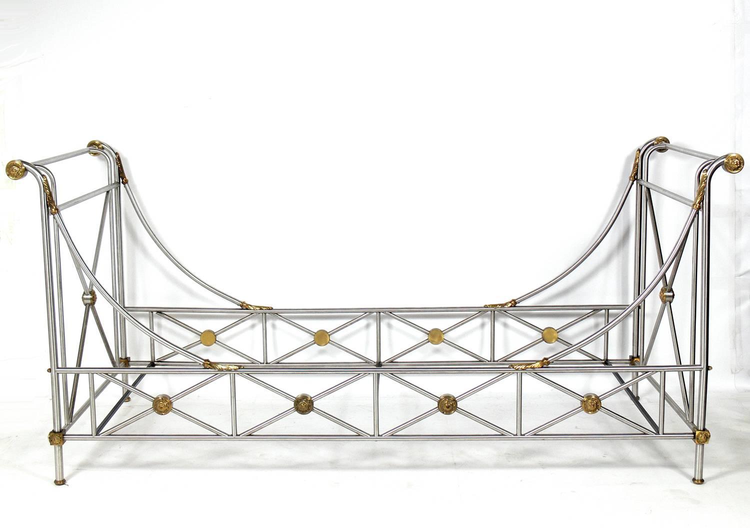 Neoclassical campaign style daybed, designed by Maison Jansen, circa 1970s. It is executed in steel with bronze fittings. Another example, from the collection of Reed Krakoff, creative director of Coach, was featured in Elle Decor, September 2006,