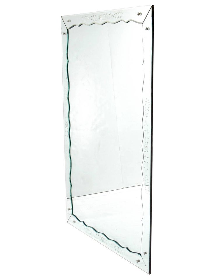 Large-scale Art Deco Venetian style mirror, probably American, circa 1940s. This piece is a large-scale size at 6 feet height x 4 feet wide and would look great in a living area, or in a bedroom, closet, or dressing room as a full length mirror.