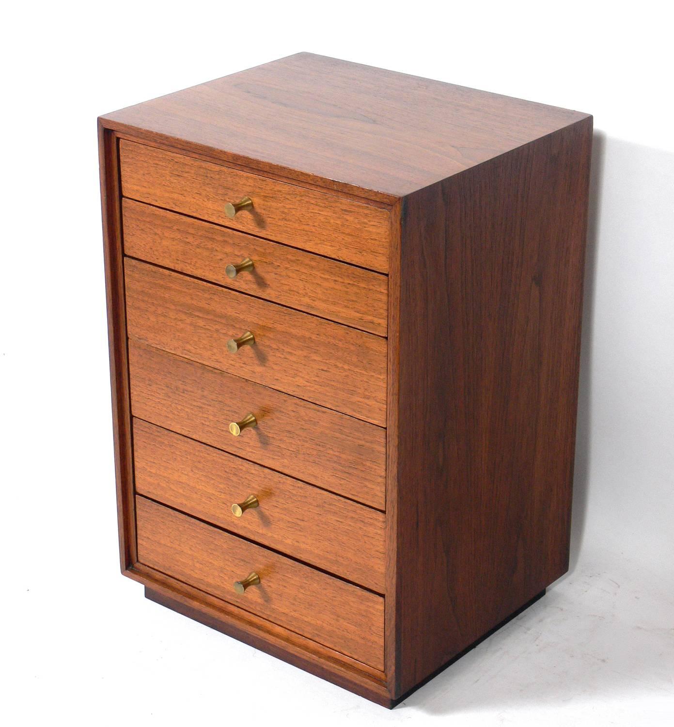 Paul McCobb style jewelry box or chest, American, circa 1950s. This petite semainier chest is a versatile size and can hold your jewelry, accessories, or unmentionables.