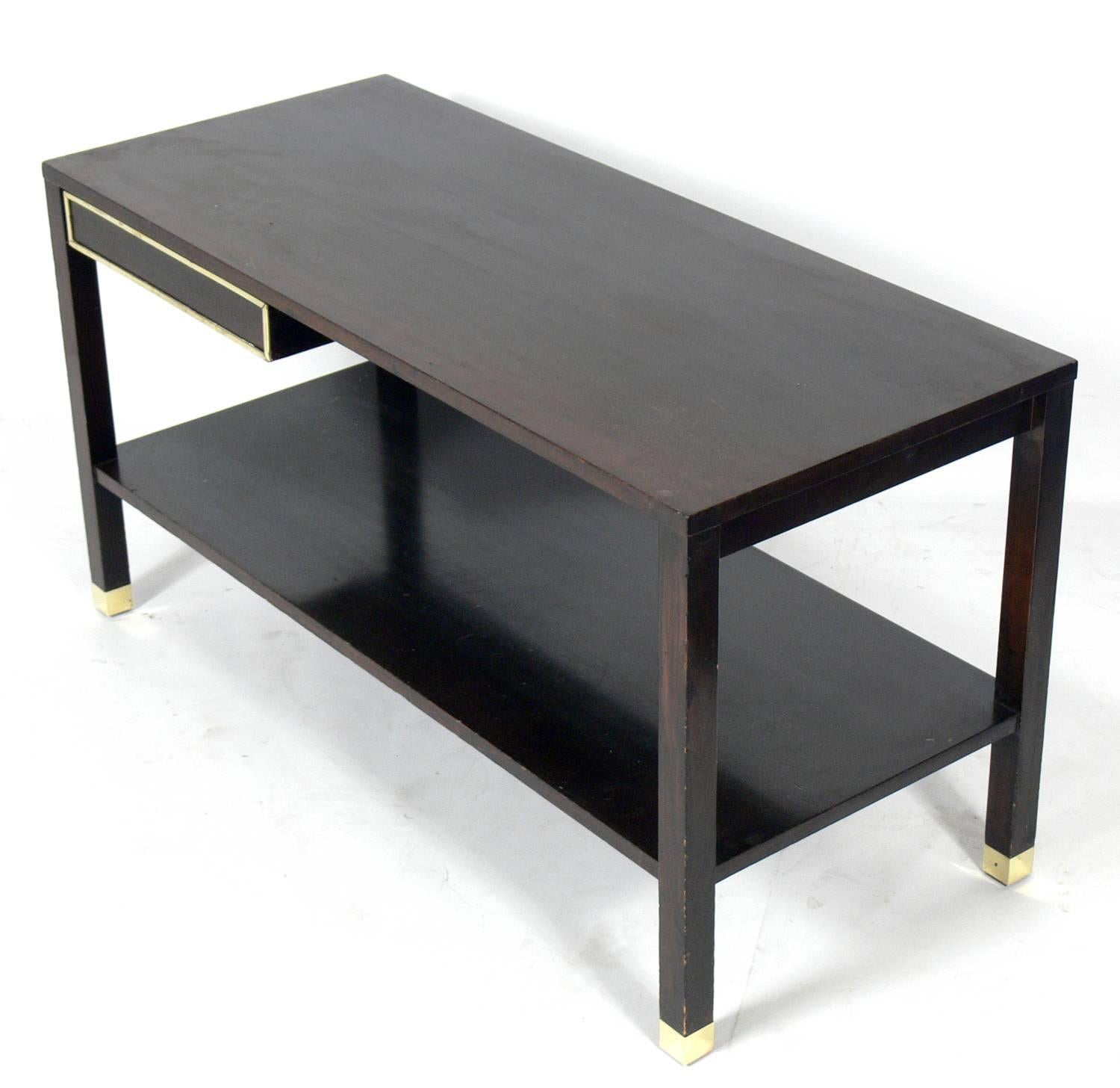 Low slung console table or bar by Harvey Probber, American, circa 1960s. This piece is currently being refinished. The price noted below includes refinishing. This piece is a versatile size and can be used as a console table, media table, or bar.
