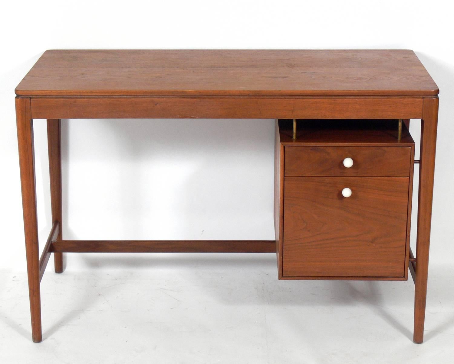 Clean lined walnut desk by Kipp Stewart for Drexel, American, circa 1960s. This piece is currently being refinished and will look incredible when it is completed.
