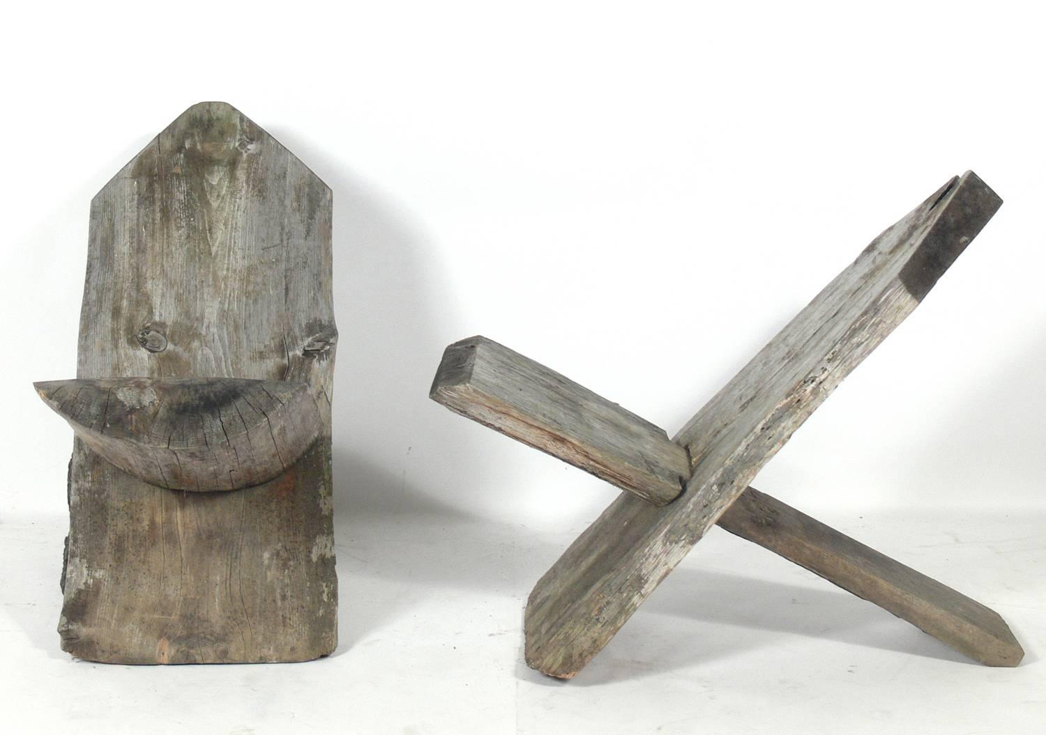 Pair of Rustic American camp chairs, probably, circa 1950s. These lived most of there life in a screened porch in the Catskill Mountains of Upstate New York, but have clearly spent some of their life outdoors. Beautiful silver gray patina.