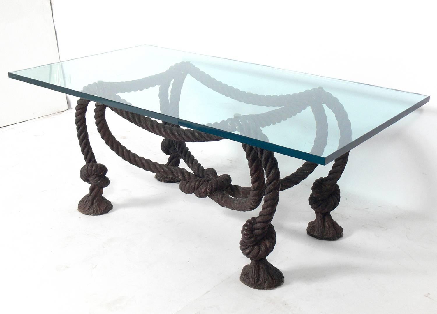 Elegant bronze rope coffee table base, French, circa 1950s. This table is believed to be constructed of bronze. Very heavyweight construction with crisp casting details. Retains warm original patina. The original glass top has several large