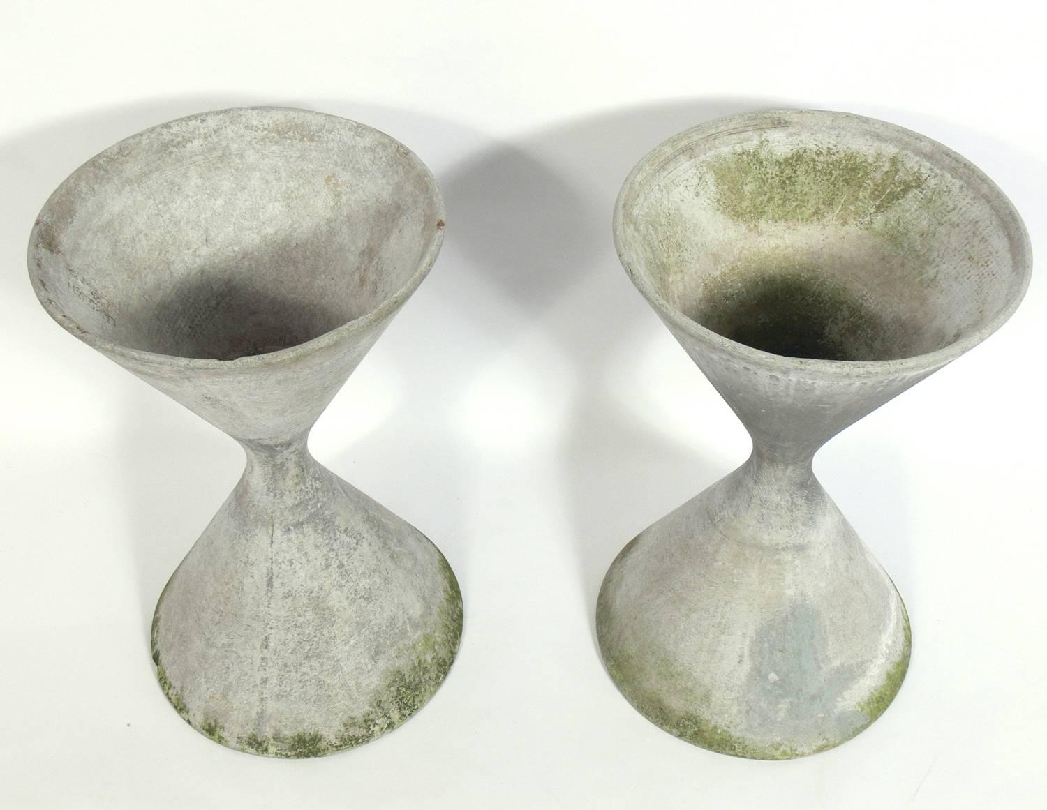 Pair of sculptural planters, designed by Willy Guhl for Eternit AG, Switzerland, circa 1960s. Signed with impressed Eternit mark. They retain their wonderful original patina. The price noted below is for the pair of planters.