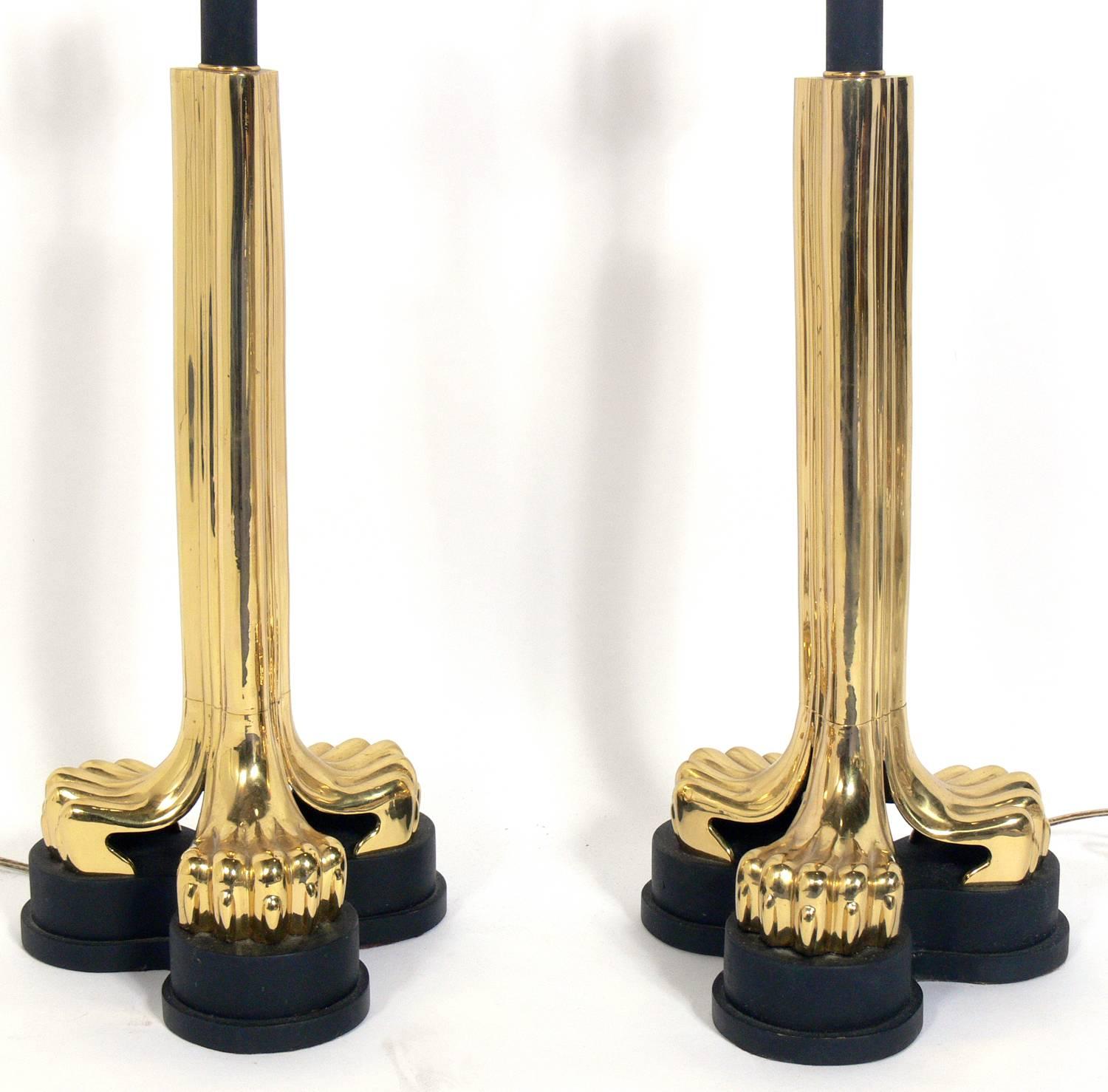 Pair of Zoomorphic brass lamps, American, circa 1970s. They have sculptural claw feet in black and brass. Rewired and ready to use. They price noted includes the shades.