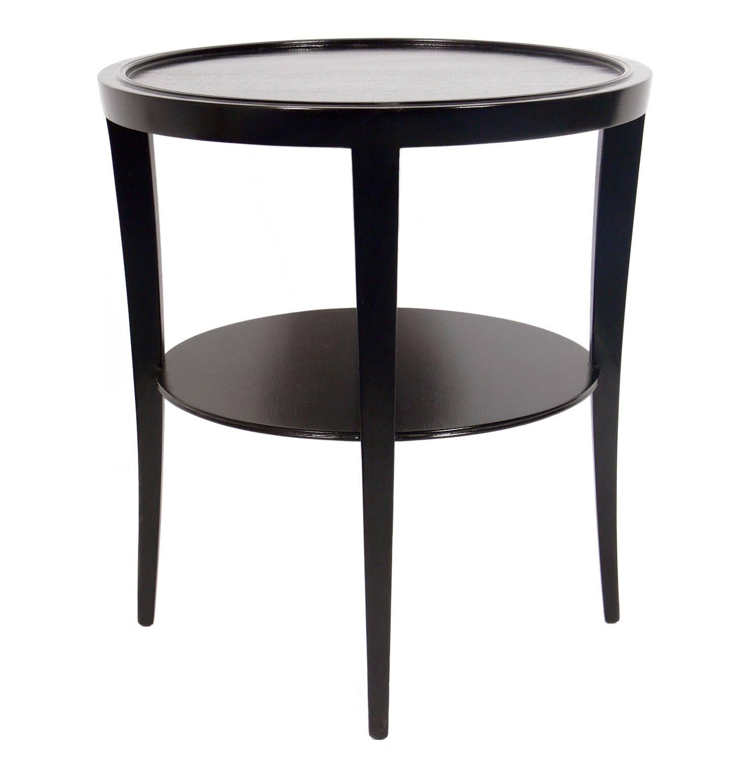 Elegant side table, designed by Tommi Parzinger for Charak Modern, American, circa 1950s. It is a versatile size and can be used as a side, centre or end table, and is perfect between a pair of chairs. The table has been refinished in black lacquer.