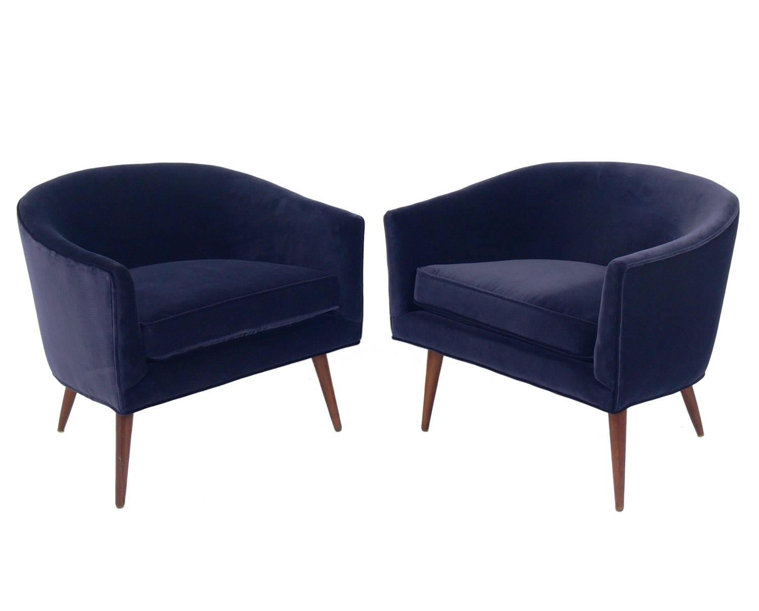 Pair of Curvaceous midcentury lounge chairs, attributed to Adrian Pearsall, American, circa 1960s. They have been reupholstered in a velvety blue fabric and the walnut legs have been cleaned and Danish oiled.