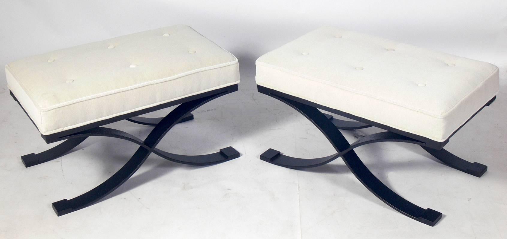 Pair of Elegant X Base Benches in Bronze Finished Metal and Ivory Velvet, American, circa 1960s. They are executed in metal with a dimpled bronze finish and newly upholstered in ivory color velvet. Very heavy and well made.