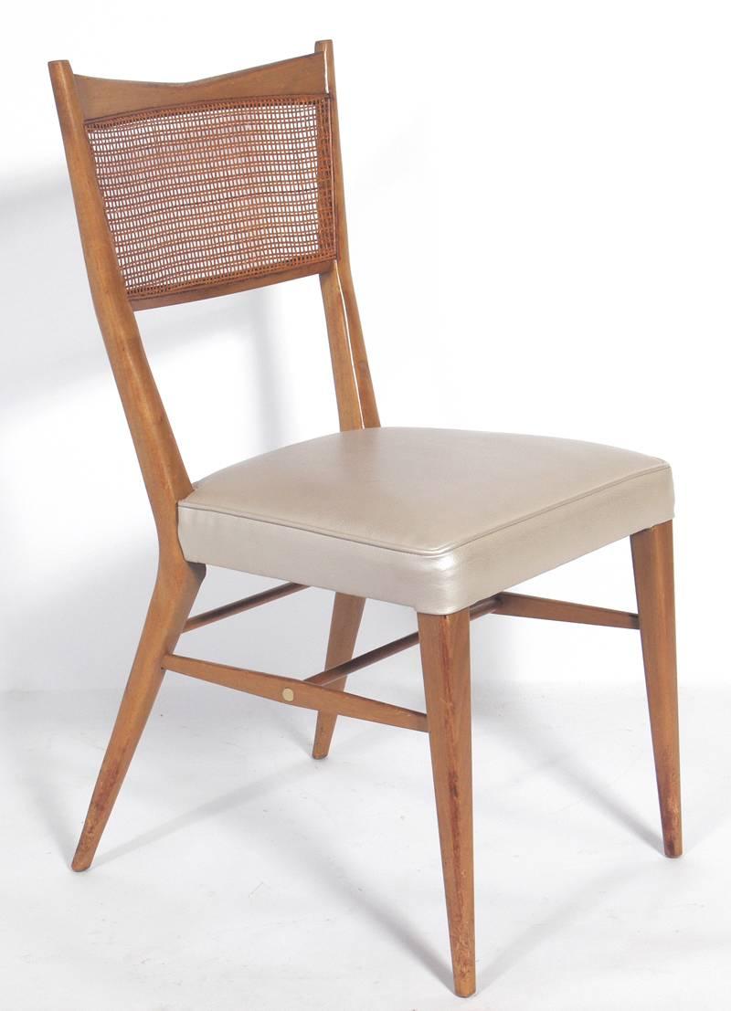 Set of Four Dining Chairs by Paul McCobb for Directional, circa 1950's. These chairs are currently being refinished and reupholstered. The price noted below INCLUDES refinishing in your choice of color and reupholstery in your fabric. They would