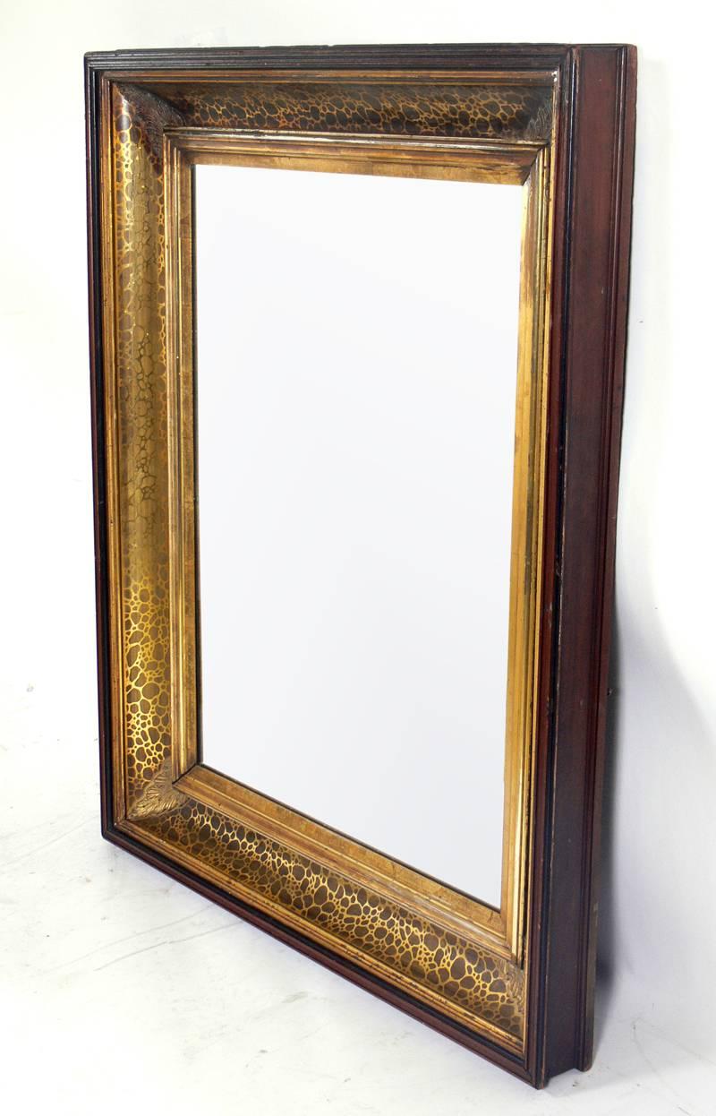 Glamorous 19th Century Gilt Mirror, probably American, circa 1880's. The elegant gilding has a leopard spot design that brings this mirror out of the 19th Century into pure Hollywood Regency glamour. Retains wonderful original patina to the gilding