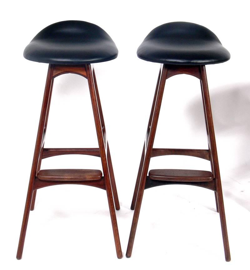 Danish modern bar stools, designed by Erik Buck for O.D. Mobler, Denmark, circa 1960s. The rosewood stools measure 33