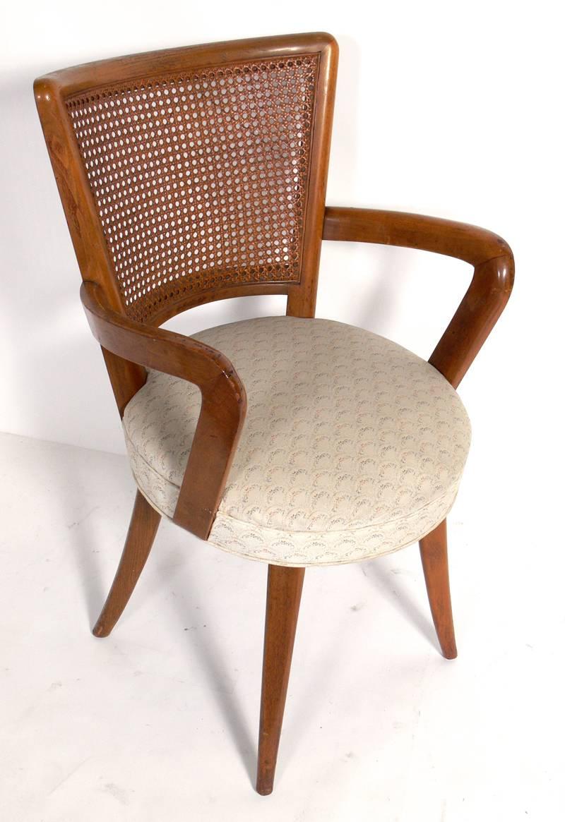 Set of four dining chairs in the manner of Vladimir Kagan, American, circa 1950s. Curvaceous sculptural form and very comfortable.
This set is currently being refinished and reupholstered and can be completed in your choice of color finish and
