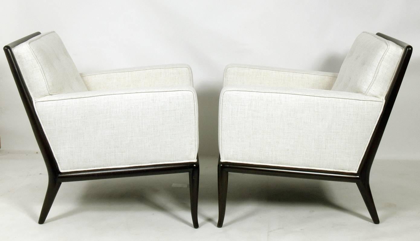 Pair of elegant lounge chairs, designed by T.H. Robsjohn Gibbings for Widdicomb, American, circa 1950s. They have been completely restored in an ivory herringbone fabric and the frames have been refinished in an ultra-deep brown lacquer.