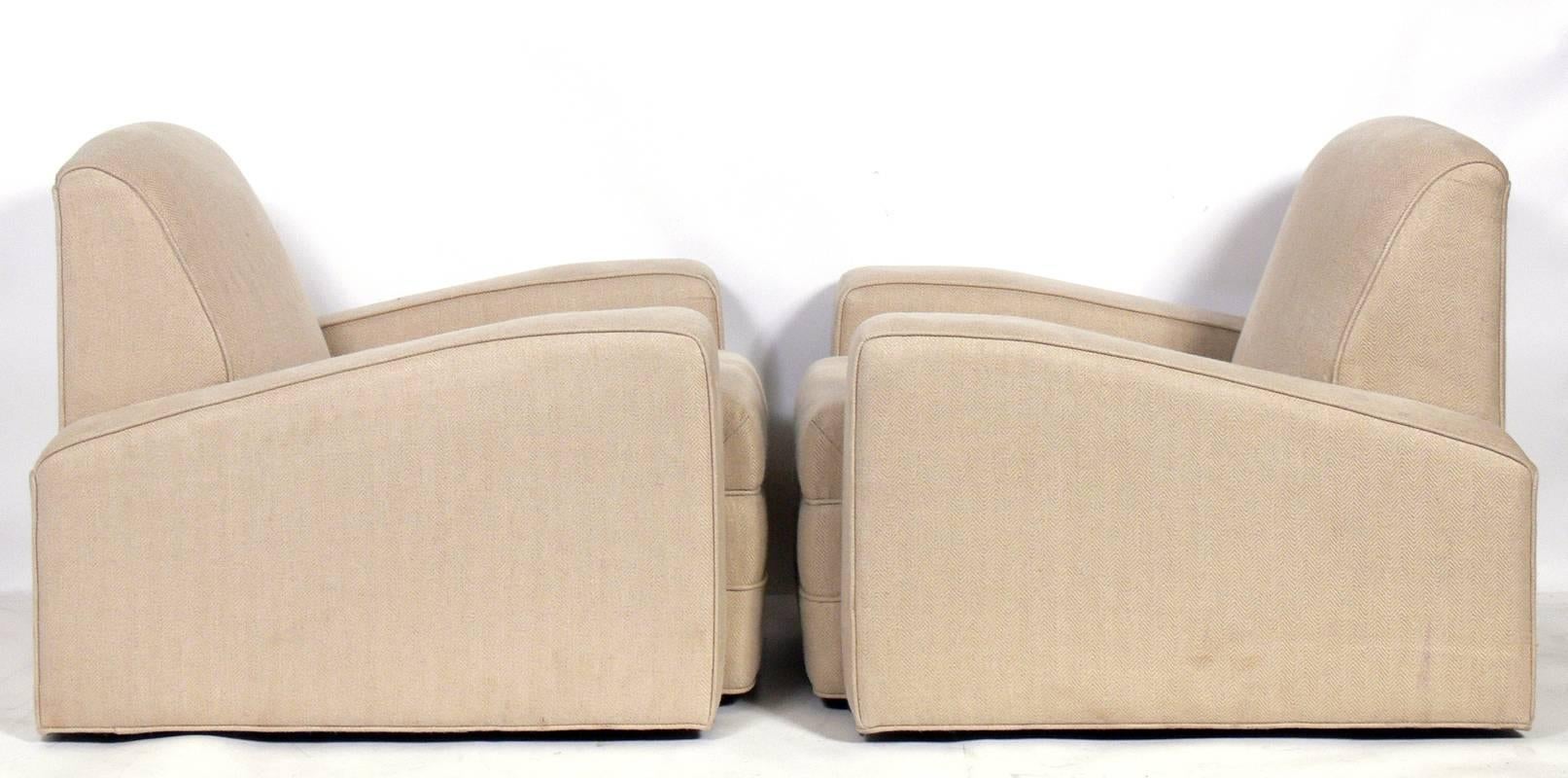 Pair of low slung Art Deco lounge chairs, French, 1930s. They have a chic low slung form. They are currently being reupholstered and can be completed in your fabric. The price noted below includes reupholstery in your fabric. Simply send us 12 yards