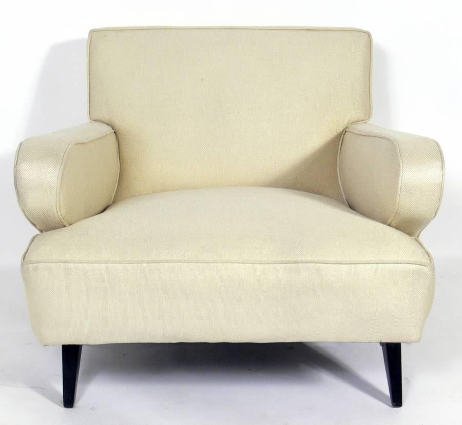 Mid-Century Modern upholstered lounge chair, American, circa 1950s. It is currently being reupholstered and can be completed in your fabric at no additional charge.